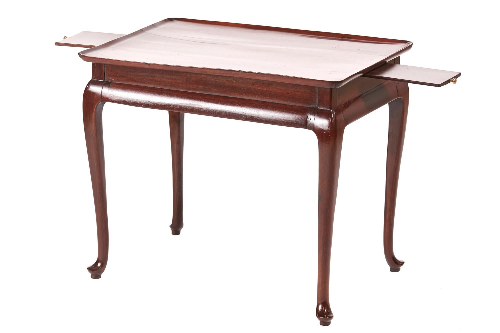 George III antique mahogany tray top silver table which has a lovely mahogany tray top with shaped corners, two candle slides to the frieze and standing on four cabriole legs with pad feet.

WORLDWIDE SHIPPING

We are able to ship this item