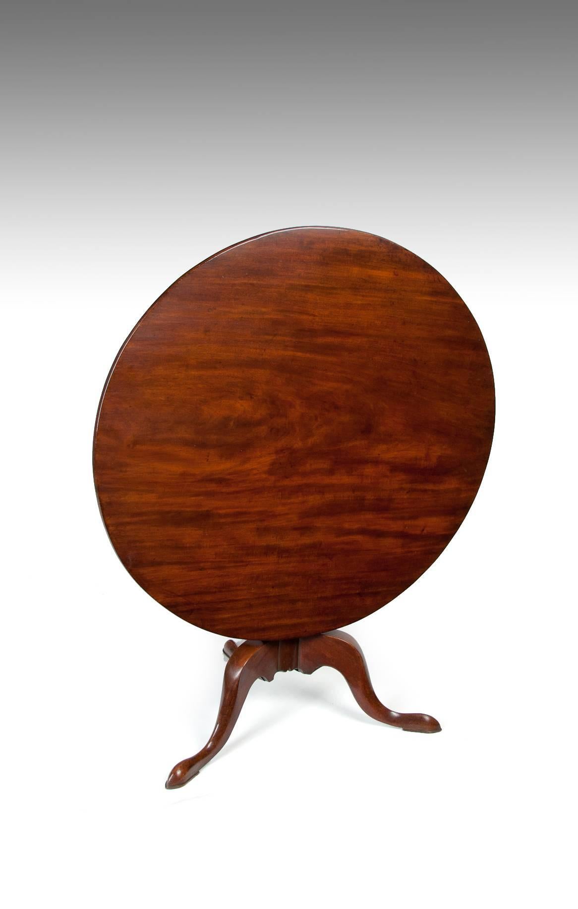 A large George III 3 ¼ foot (approximate 1m) diameter solid mahogany tripod / supper table, circa 1770.
The fine quality large sized well figured mahogany circular hinged top supported by a vase shaped central column on cabriole tripod legs