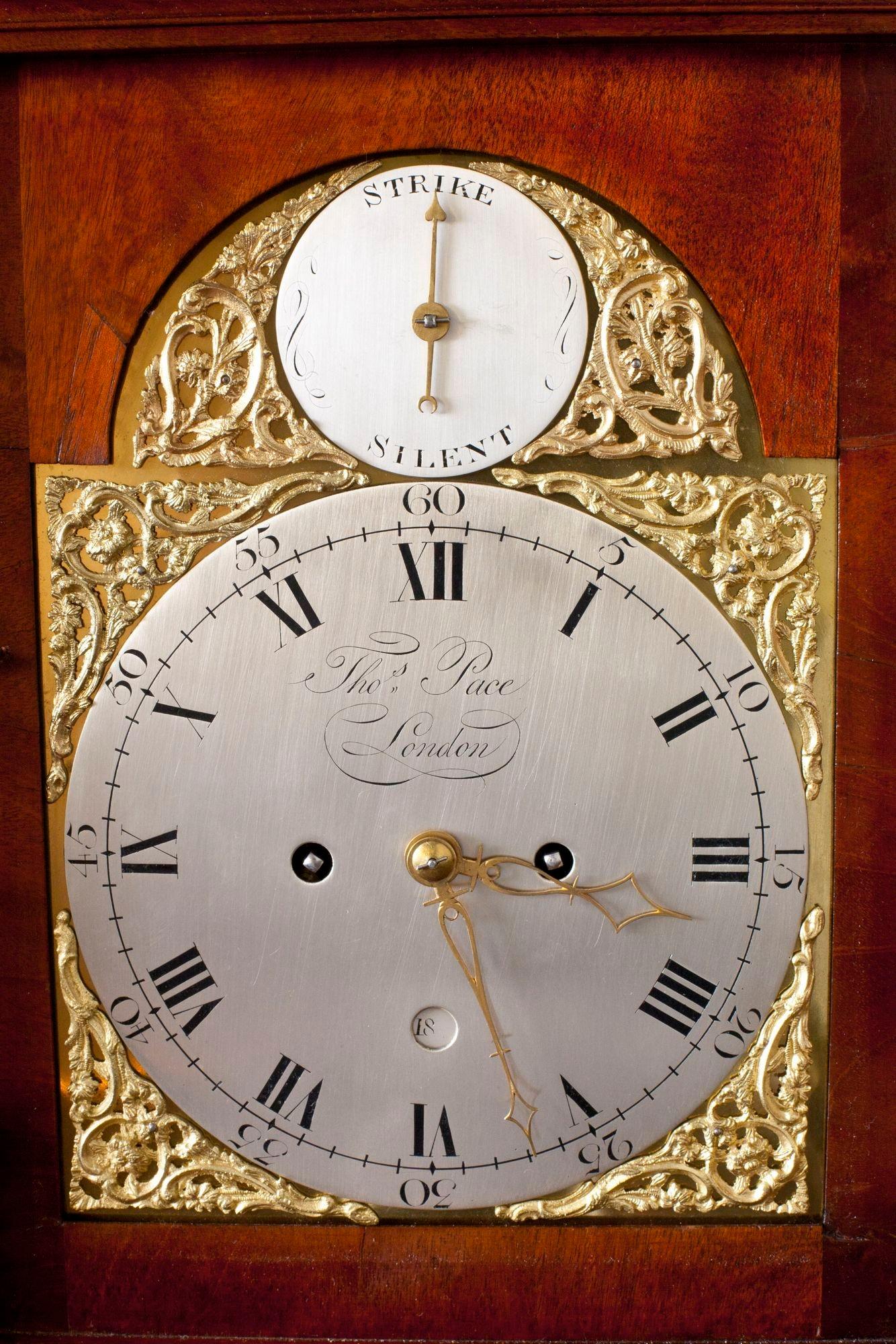 George III Bell Top Bracket Clock
 
Fine flame mahogany case with ormolu mounts and ormolu caryatids standing on bracket feet. Silvered dial with subsidiary dial for strike/silent, Roman numerals, date aperture above the VI and signed Thomas Pace,