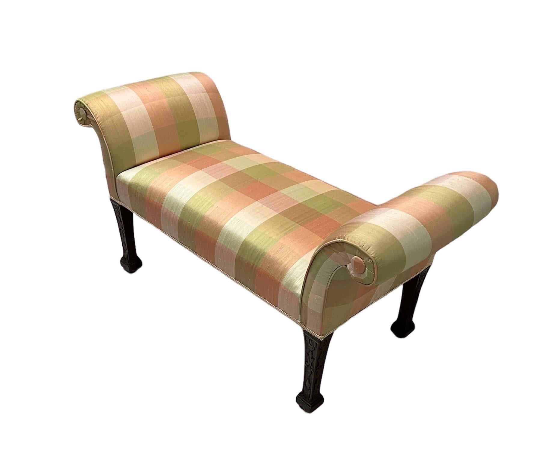 George III mahogany window bench
Scrolled upholstered arms, Upholstered seat
With gimp trim on carved square tapering legs. Legs terminating in square feet concealing leather castors.