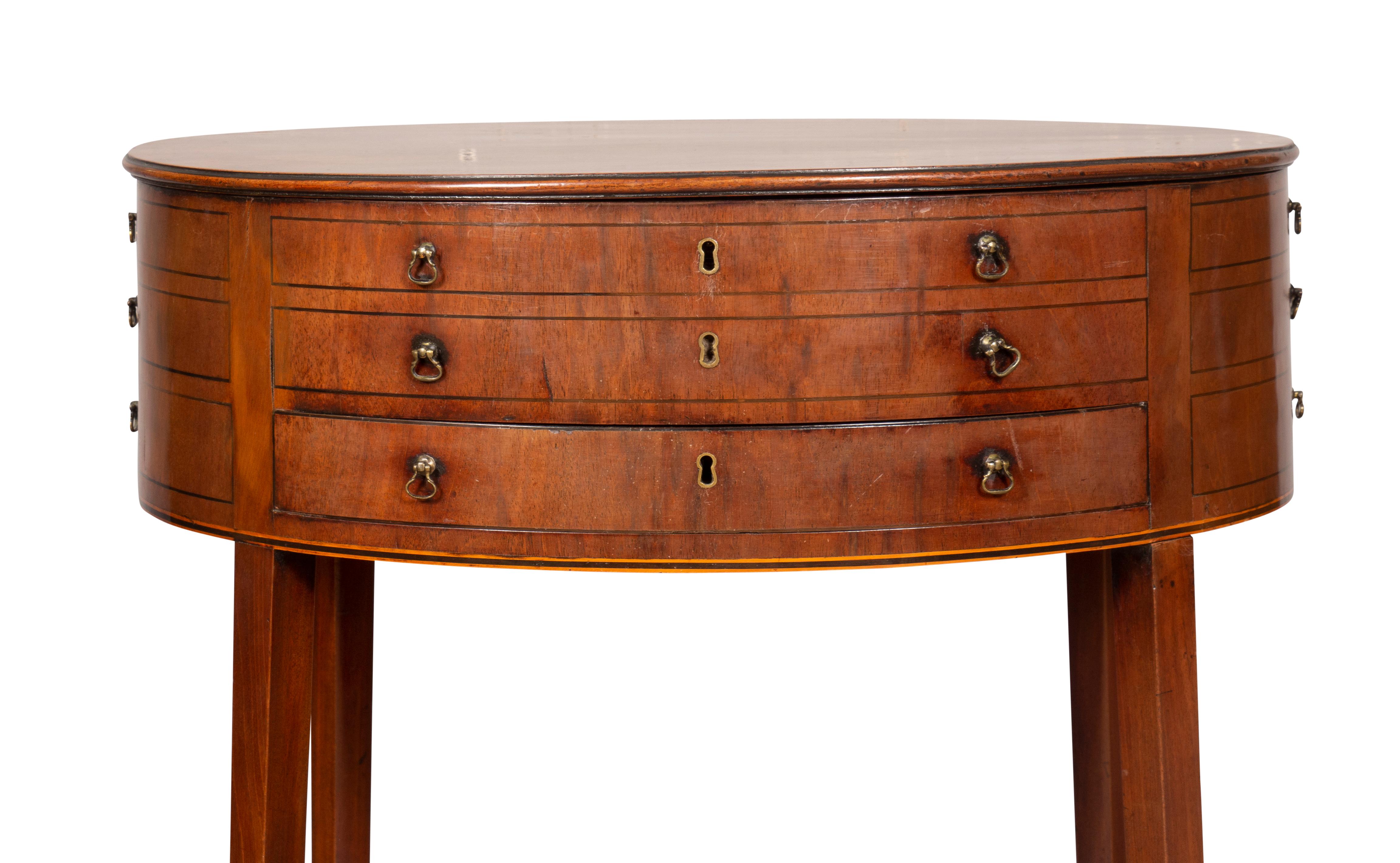 Oval hinged top and open interior over a conforming case with faux drawers and working drawer.
Square splayed legs and X form stretcher. With key.