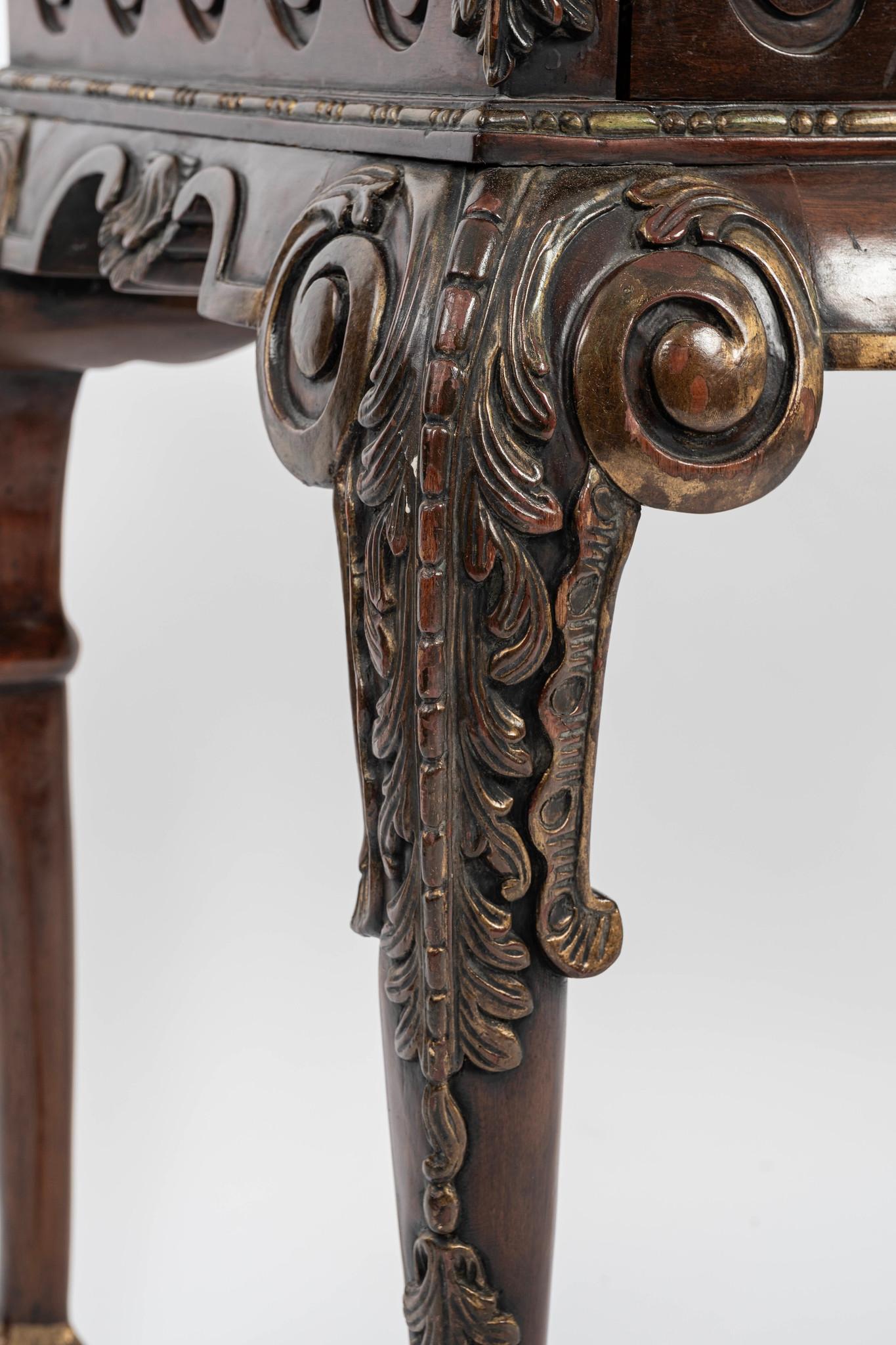 A lovely 19th Century George III style hand carved console with scrolling, acanthus, and ball claw features.