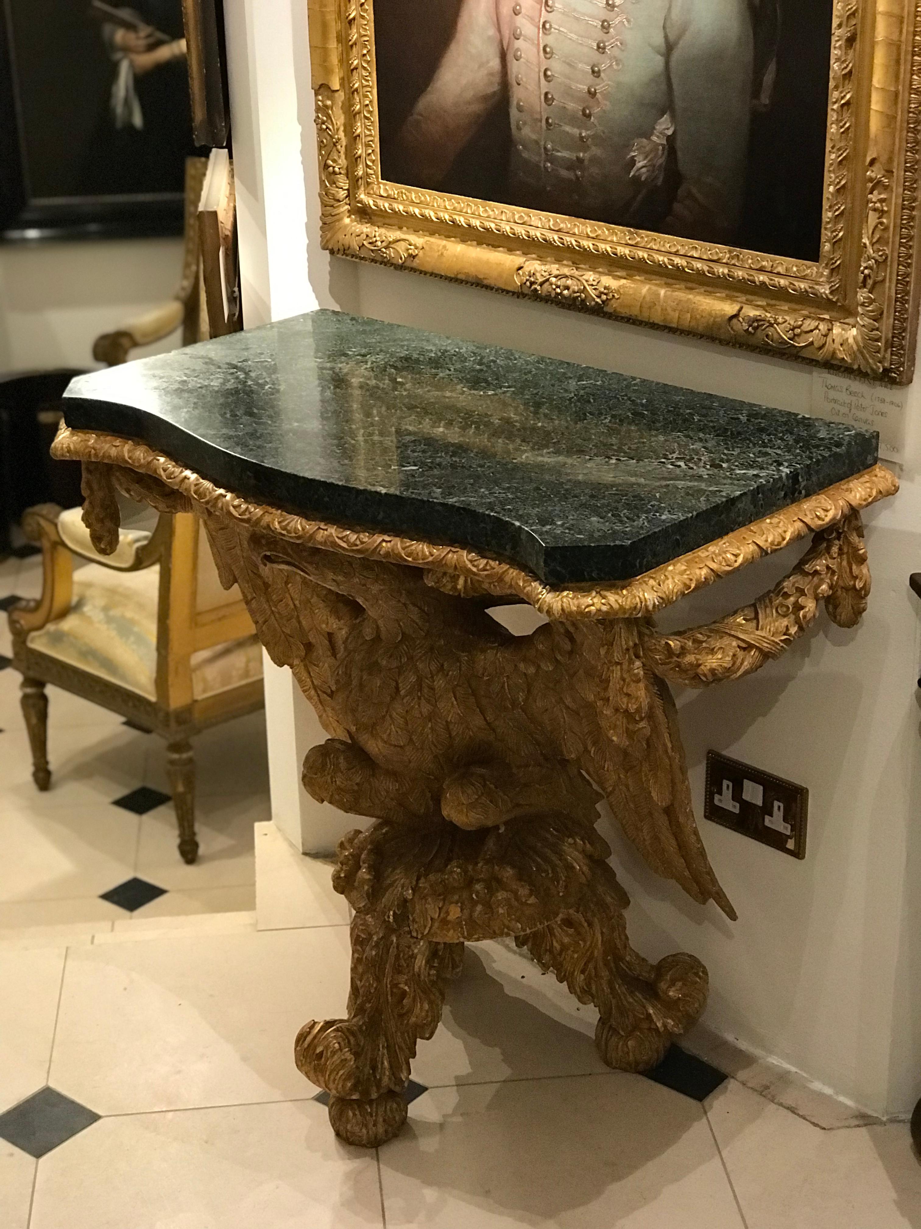 George III marble topped console table with intricate carved giltwood eagle base.
Green marble top,
circa 1780-1800.


Measures: Height 86 cm
Width 90.5 cm
Depth 49.5 cm.
   