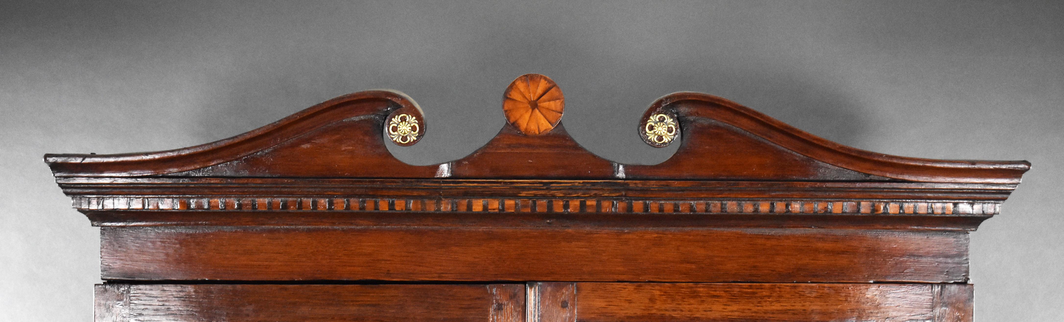 George III Oak Bureau Bookcase
Item Code: 1315
A fine George III period oak bureau bookcase, c.1780, of elegant proportions and good colour. The upper section features a moulded swan-neck pediment with central shell inlay and decorative roundels,