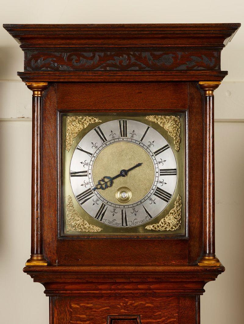 George III longcase clock by Francis Whitton, circa 1740.
 

The case is made from the finest English oak, the long trunk door typical of the period still retains it’s original engraved ‘H’ hinges and escutcheon. The hood door still with it’s