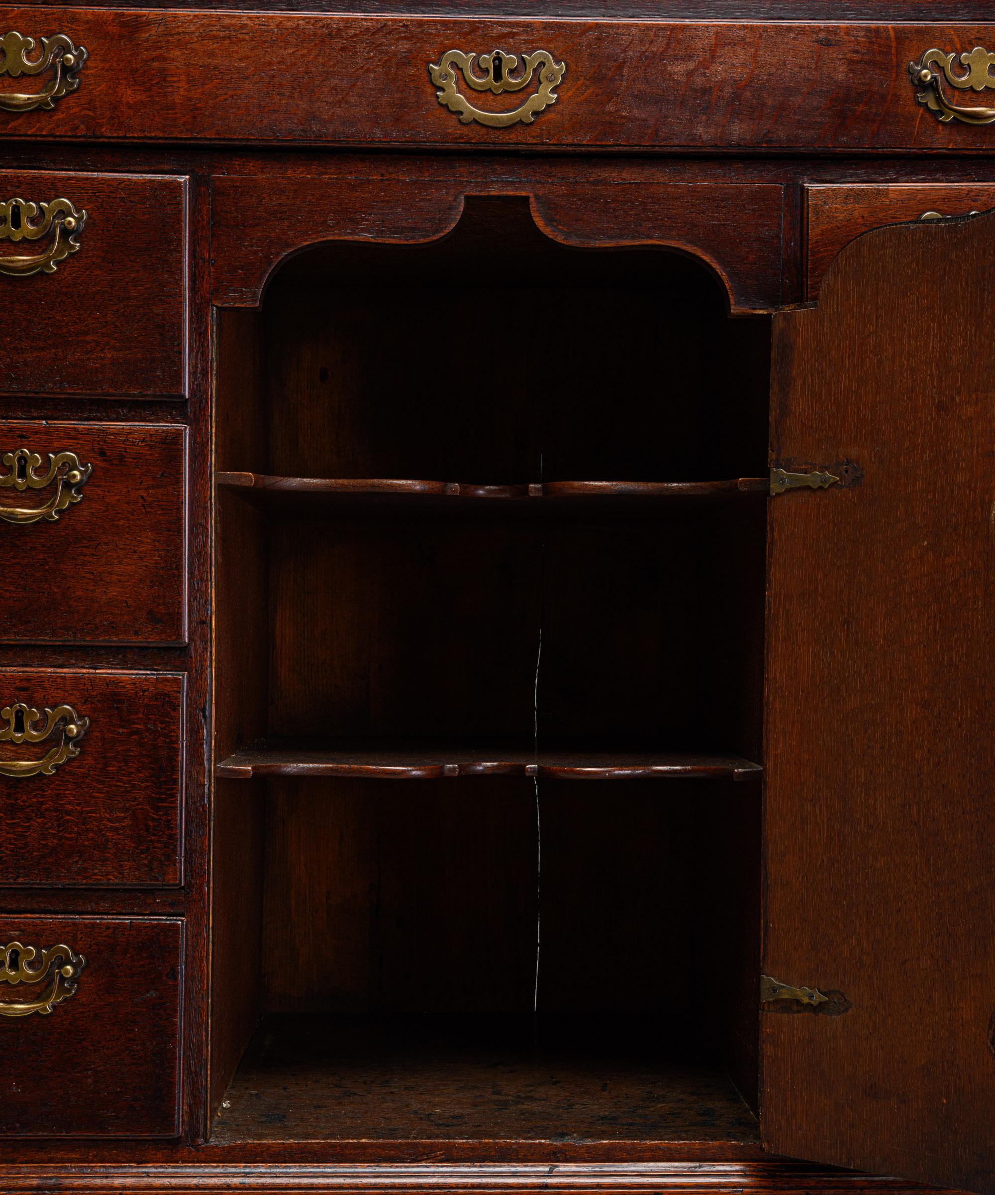 George III oak cupboard

England, circa 1830

Unusual “chest on chest” with middle cupboard section. Original brass hardware.