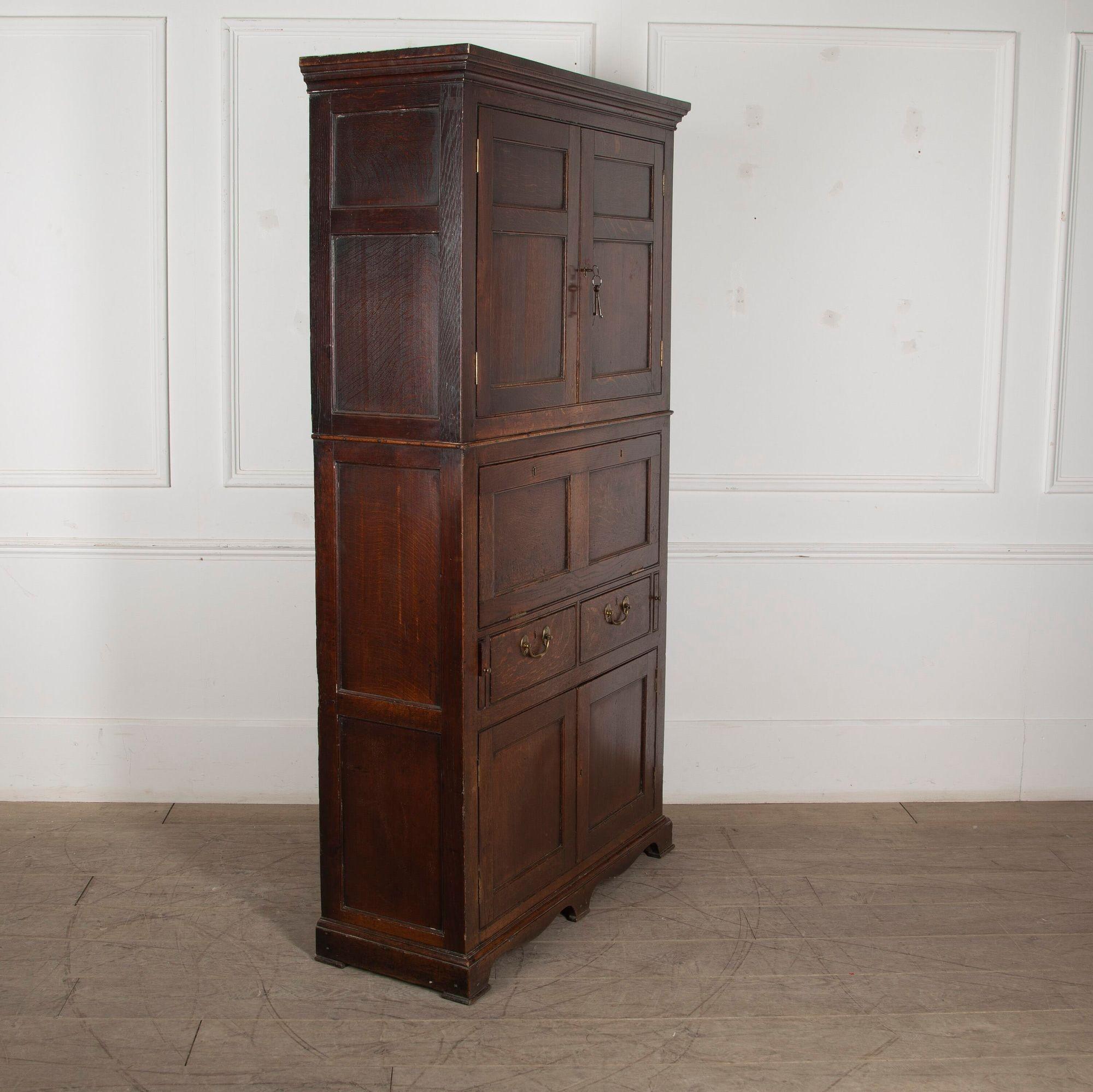 Truly wonderful early 19th Century George III oak secretaire estate cupboard.
This cupboard is of small proportions and was made by an accomplished cabinet maker.
In totally untouched condition, original handles, hinges, locks, keys, feet, and the