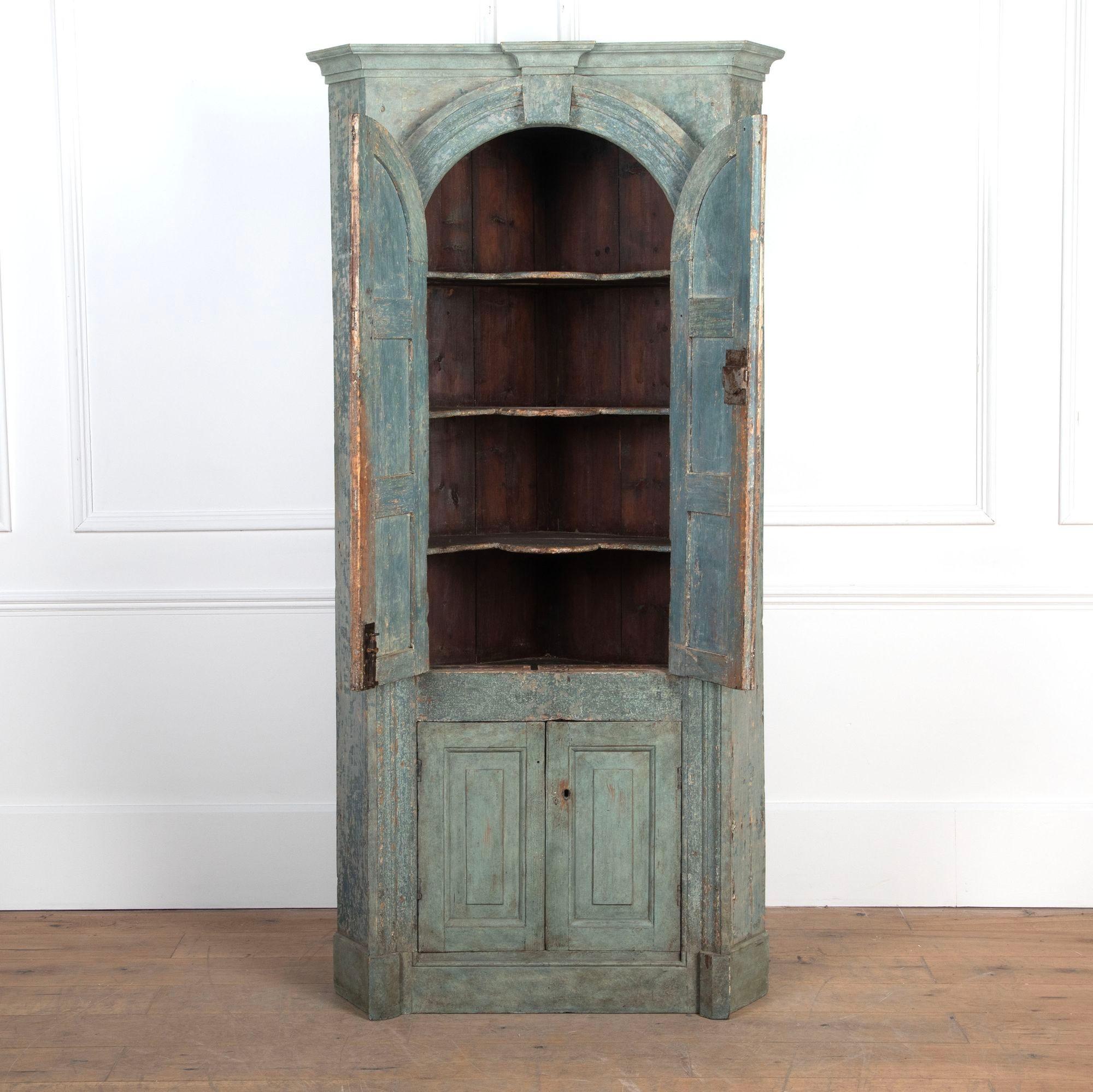Wonderful decorative late 18th Century floor standing pine corner cupboard.
Creatively dry scraped back to reveal layers of original blue paint.
English, circa 1780.