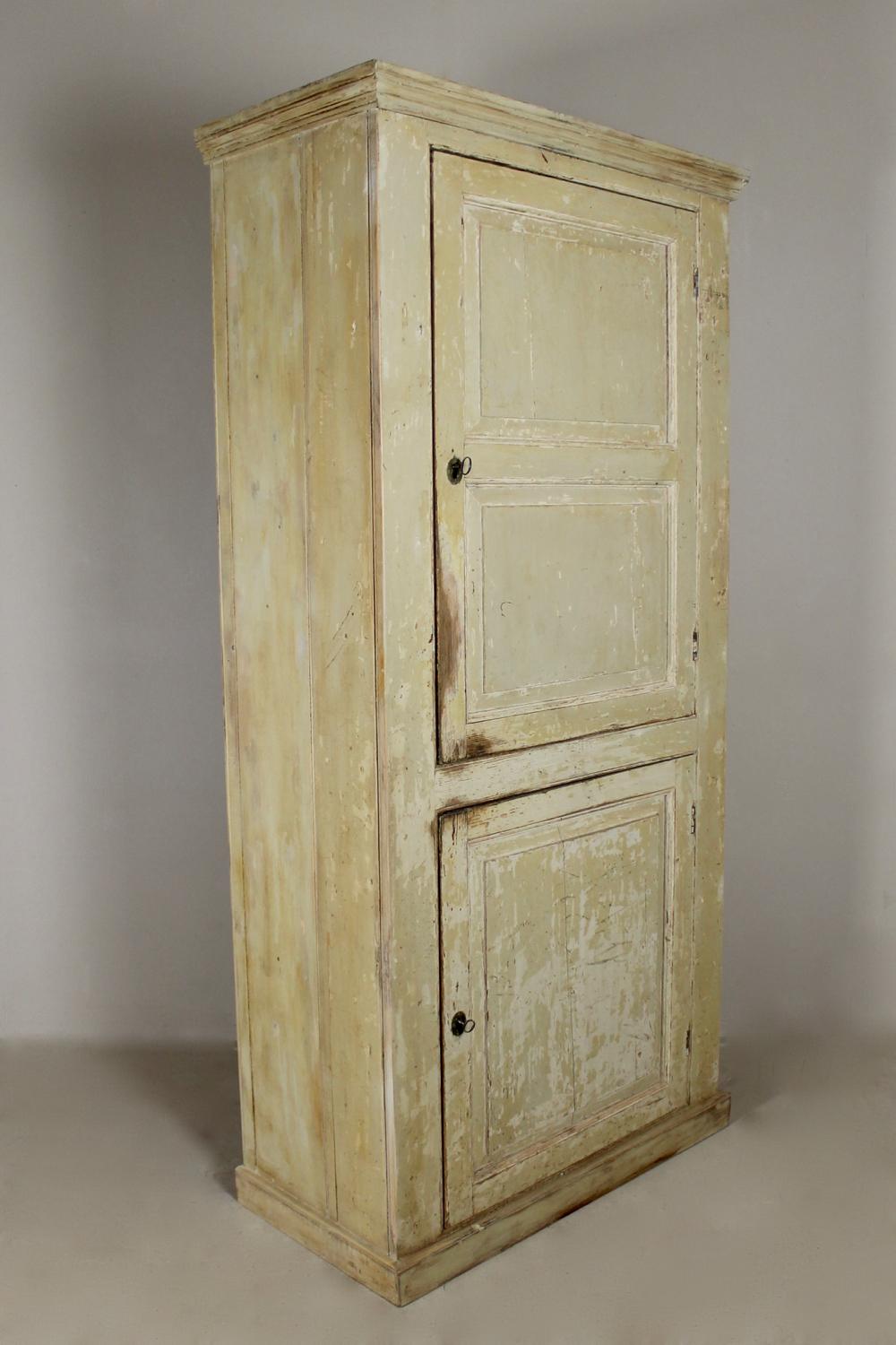 A lovely George III period, pine hall or kitchen cupboard. Dry scraped back to its original off white paint, retaining its original locks and keys, the interior with original reeded front shelves and repainted.
English, circa 1780.