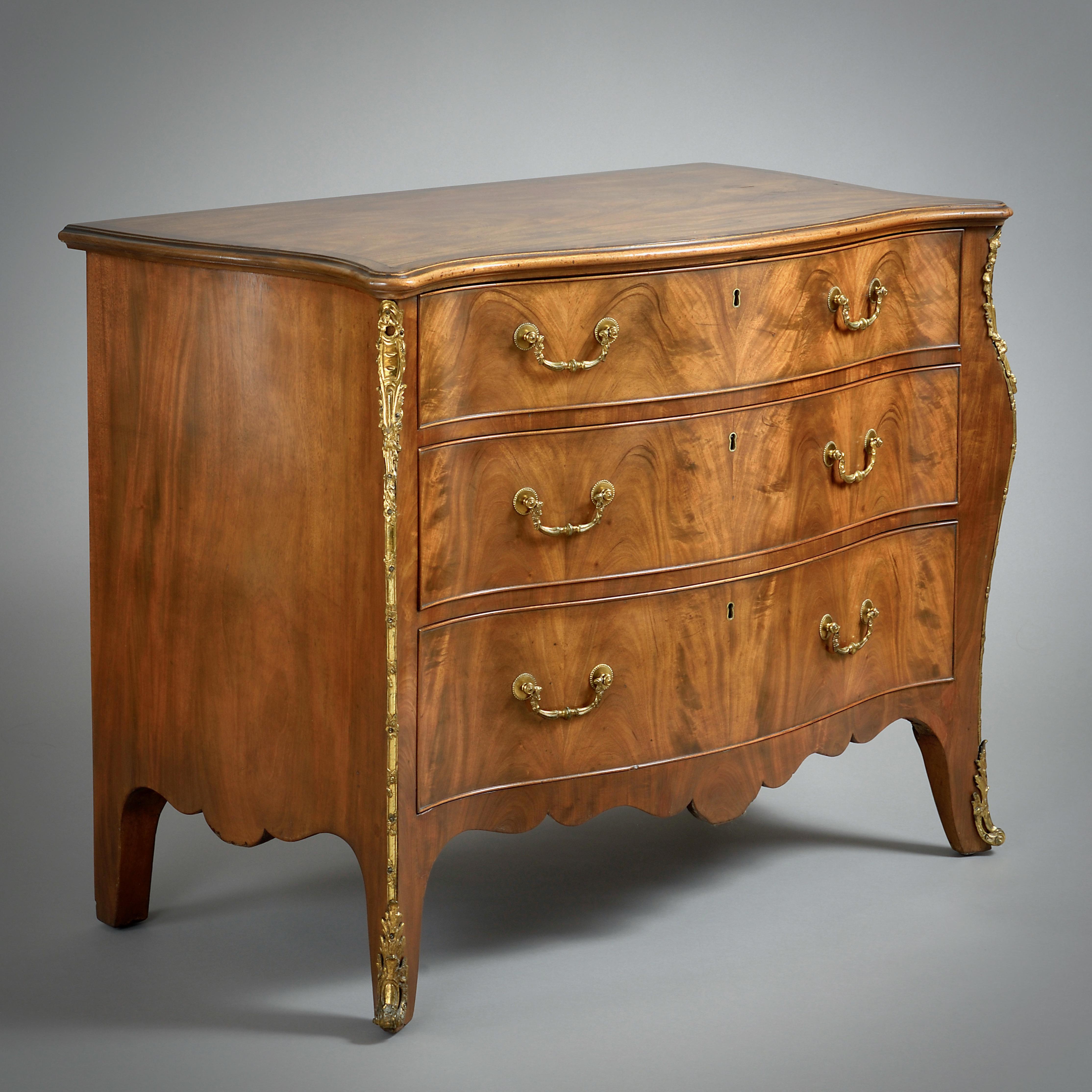 A FINE GEORGE III ORMOLU-MOUNTED MAHOGANY SERPENTINE COMMODE, CIRCA 1770.

The top drawers partially fitted. All mounts original.