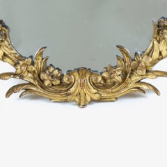 George III Oval Mirror with a Carved Giltwood Floral Frame