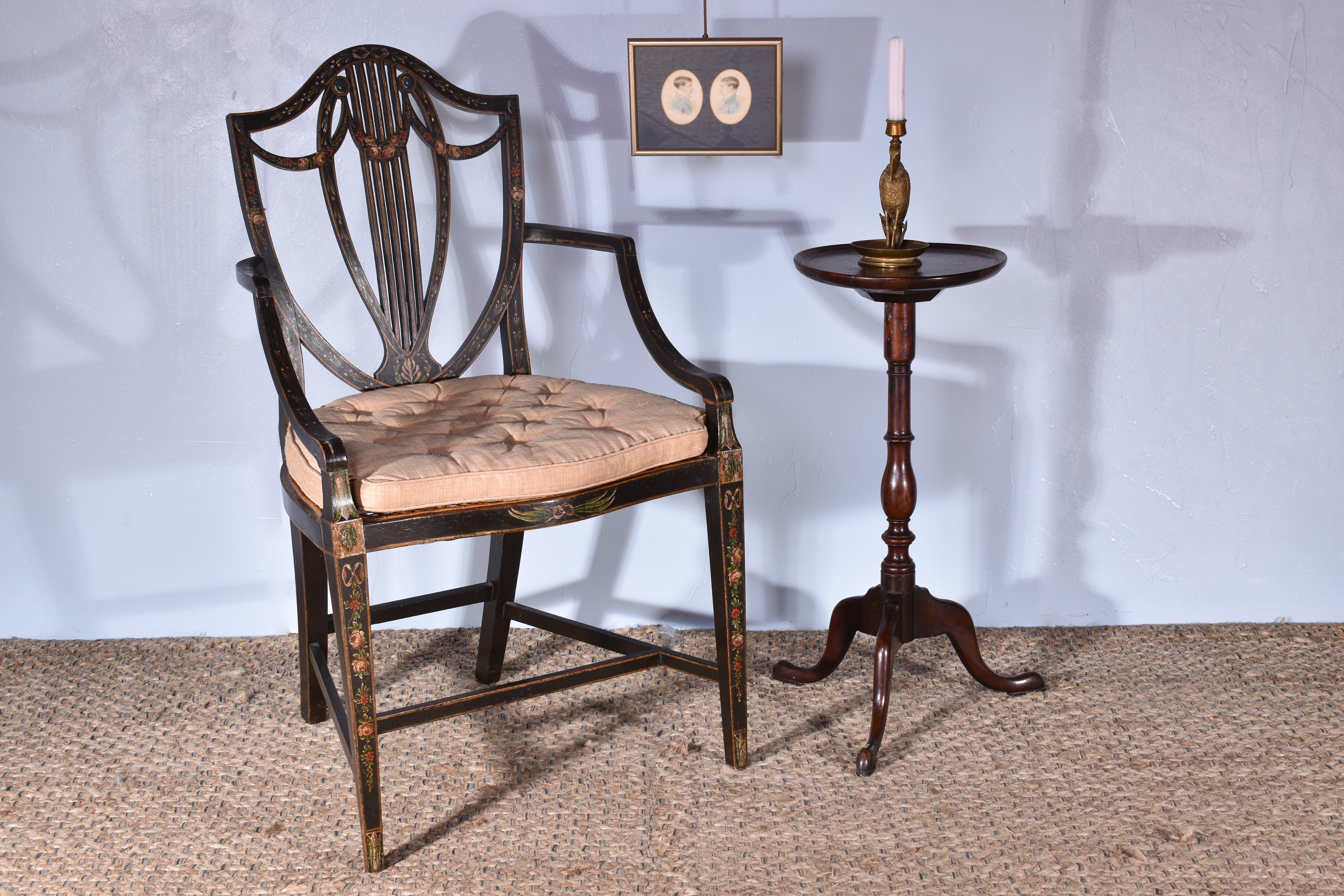 An English George III painted open armchair. C.1785

Retaining its wonderful original painted decoration.

With a caned seat and traditionally upholstered, fitted squab cushion.

Attributed to Gillows, see final image for a similar ‘new ballon back’