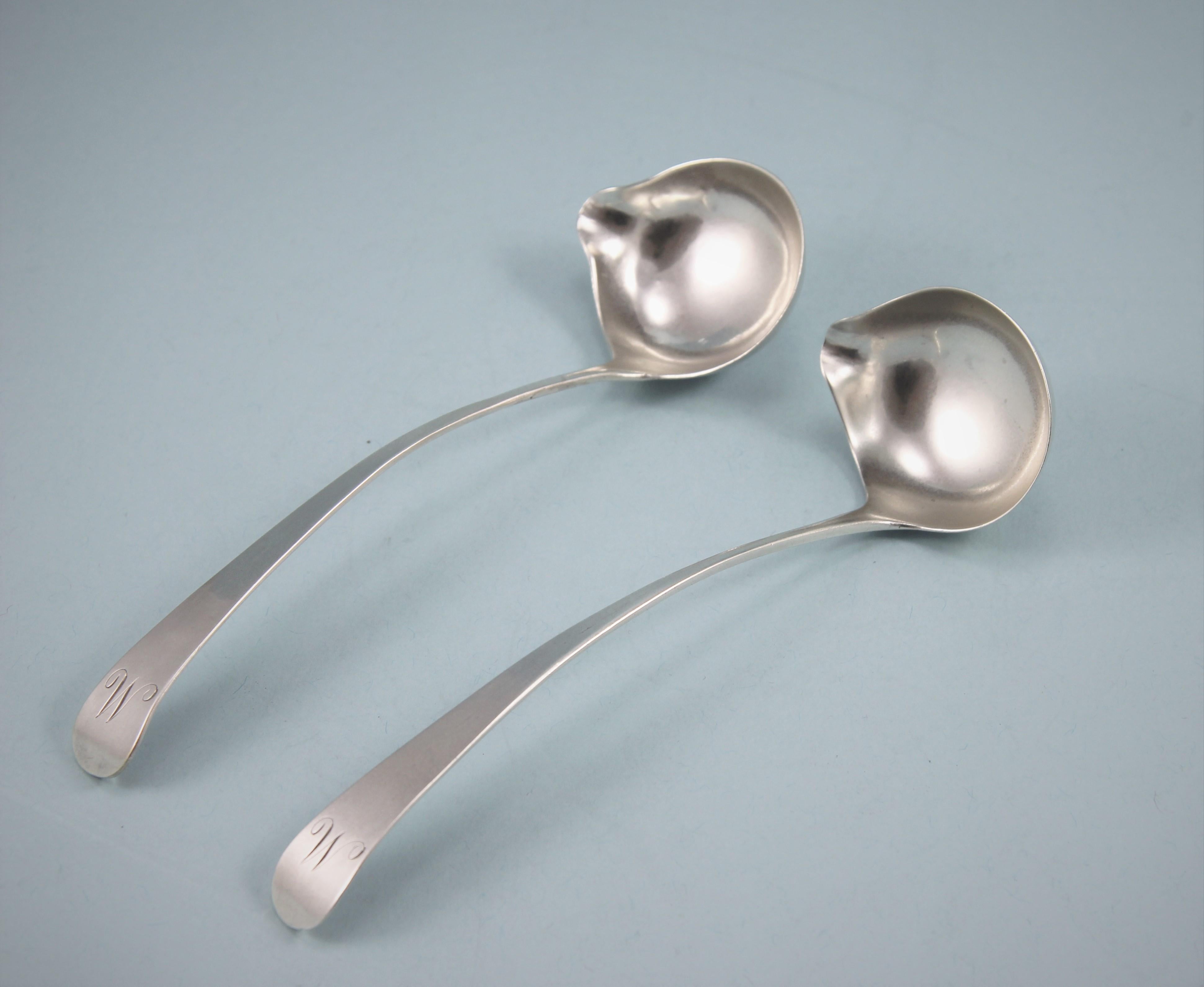 Elegant pair of George III sterling silver Scottish lipped ladles. 
Maker: WM, possible William Marshall. Edinburgh, circa 1810. 

Ladles with lips are usually found on Irish silver but it is a Celtic touch which facilitates pouring. 
The