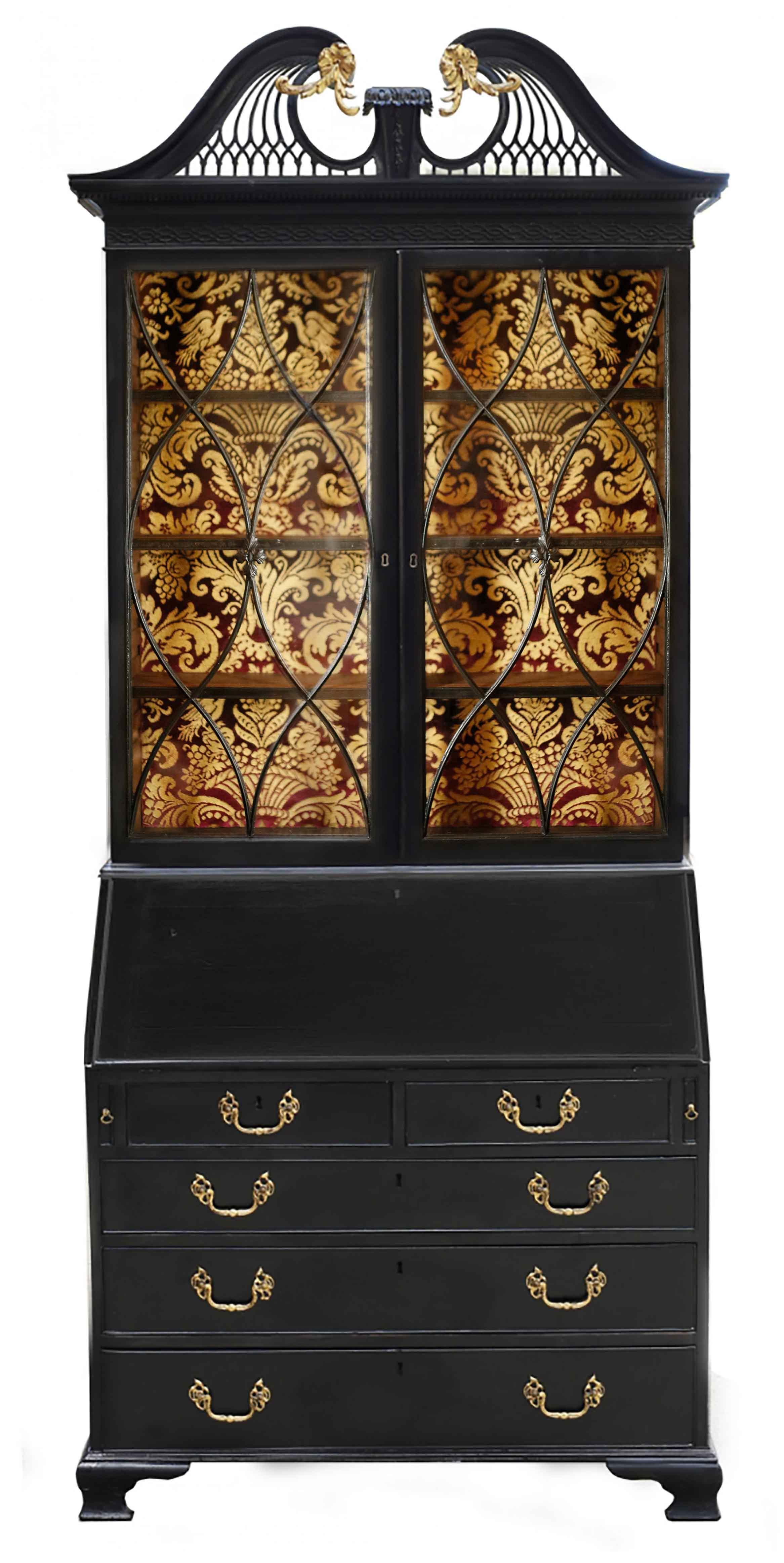 An exquisite English Georgian secretary bookcase of exceptional design and detail. The swan-necked broken pediment features gilt acanthus flourishes and rosettes with a central plinth with graduated bellflowers. The tympanum is composed of delicate