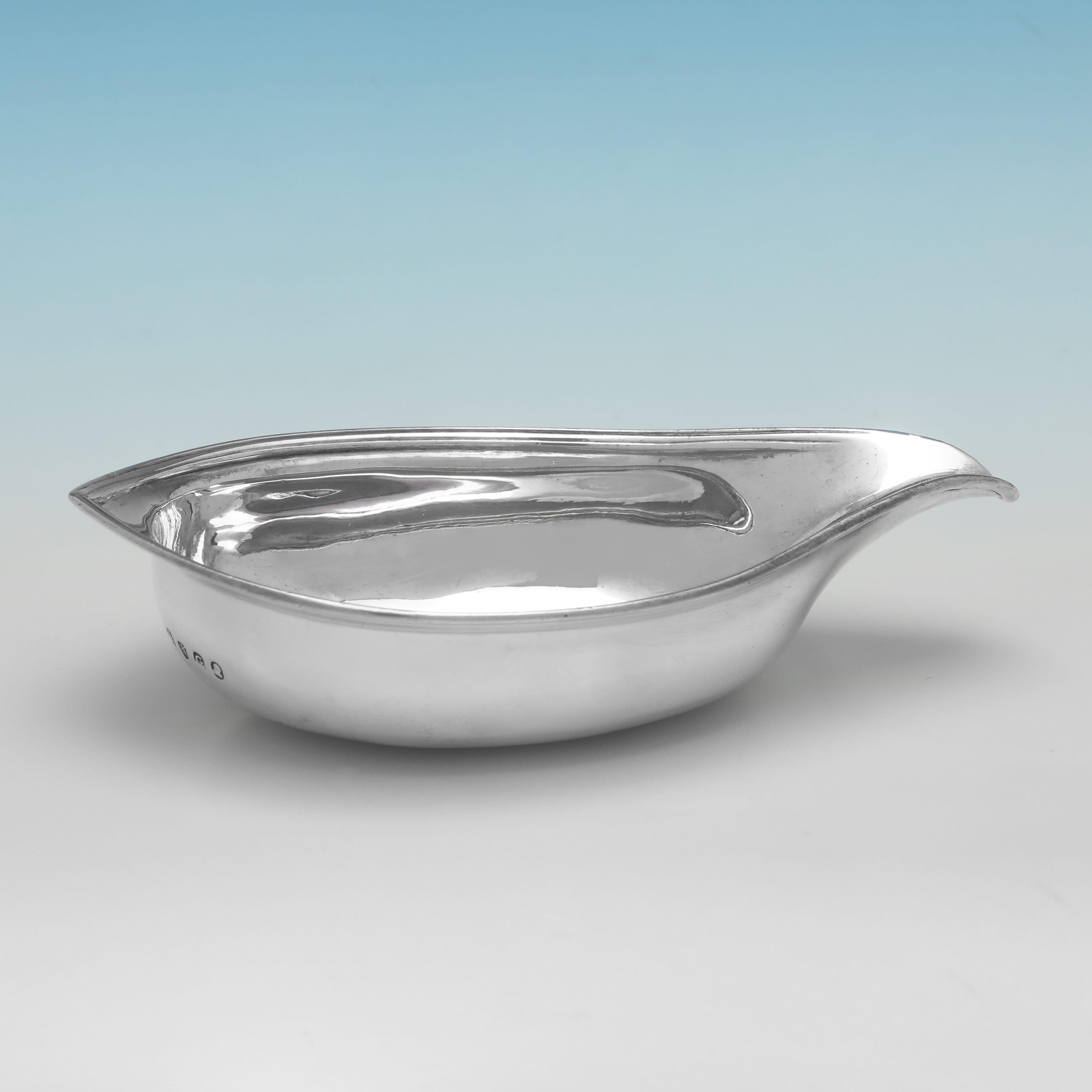Hallmarked in London in 1802 by John Emes, this handsome, George III Period, Antique Sterling Silver Pap Boat, is of traditional form, and features reed borders. 
The pap boat measures 1.25