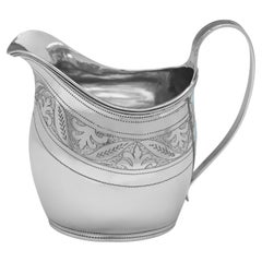 George III period engraved sterling silver cream jug made in London in 1808