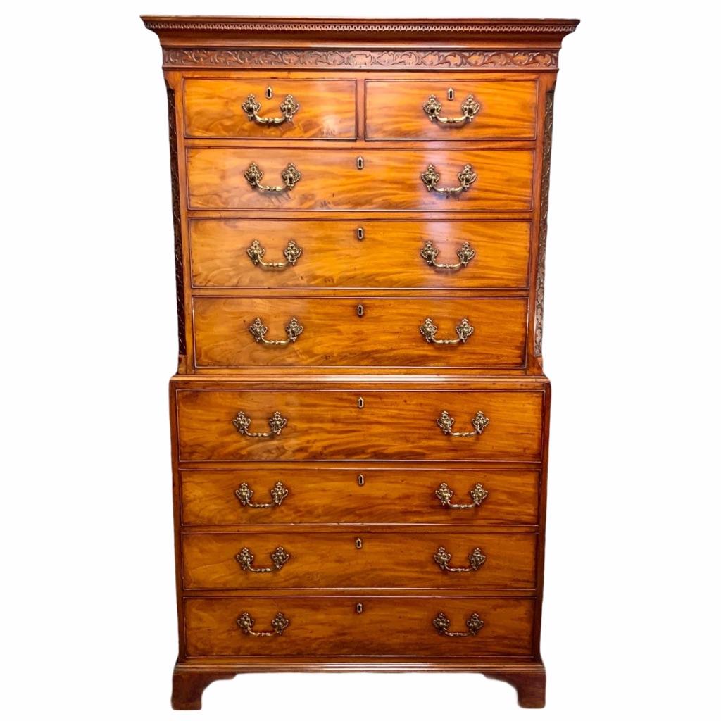 An super example of a mid-18th century mahogany tallboy with blind fretwork to the frieze and the canted corners. Houing a well fitted secretaire drawer, all retaining a lovely set of original brass handles. Good natural colour and patina.