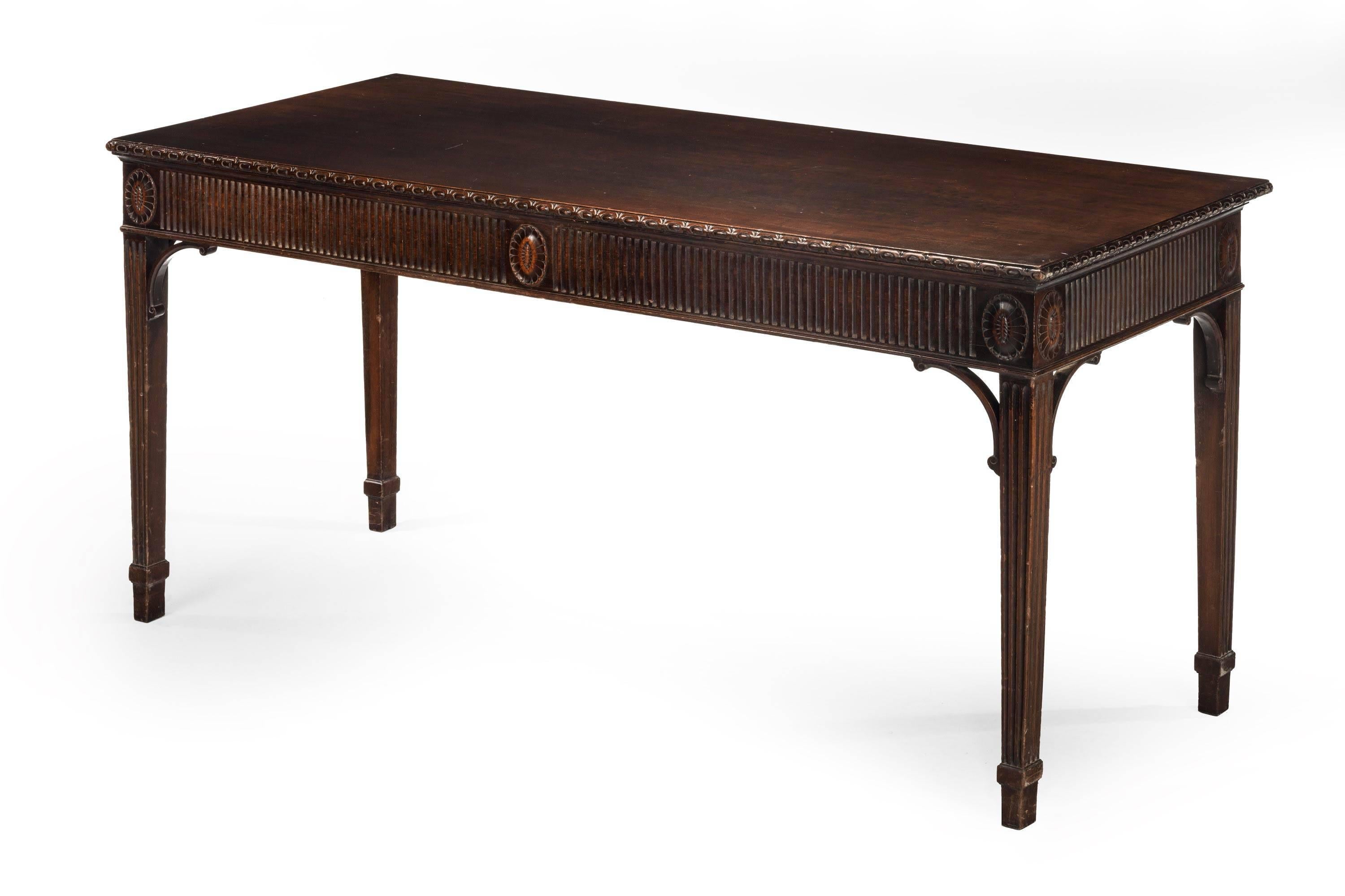 A very fine original George III mahogany serving table. With a very well carved, indented frieze and oval patera to the main part of the frieze. Quite exceptional original condition.