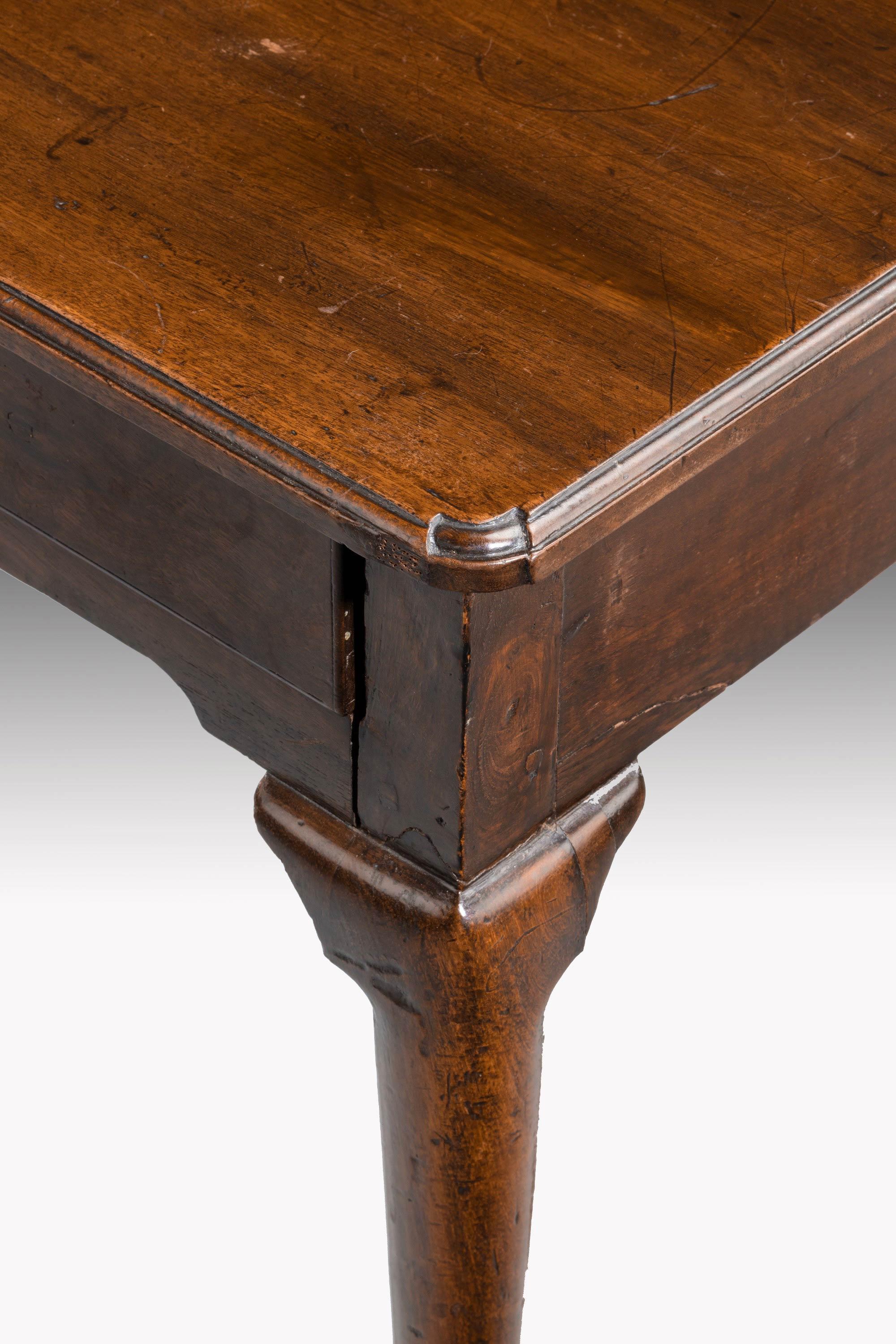An small, attractive George III period mahogany side table on cabriole supports. The top with cusp or re-entrenched corners retaining the original bat wing. 
 