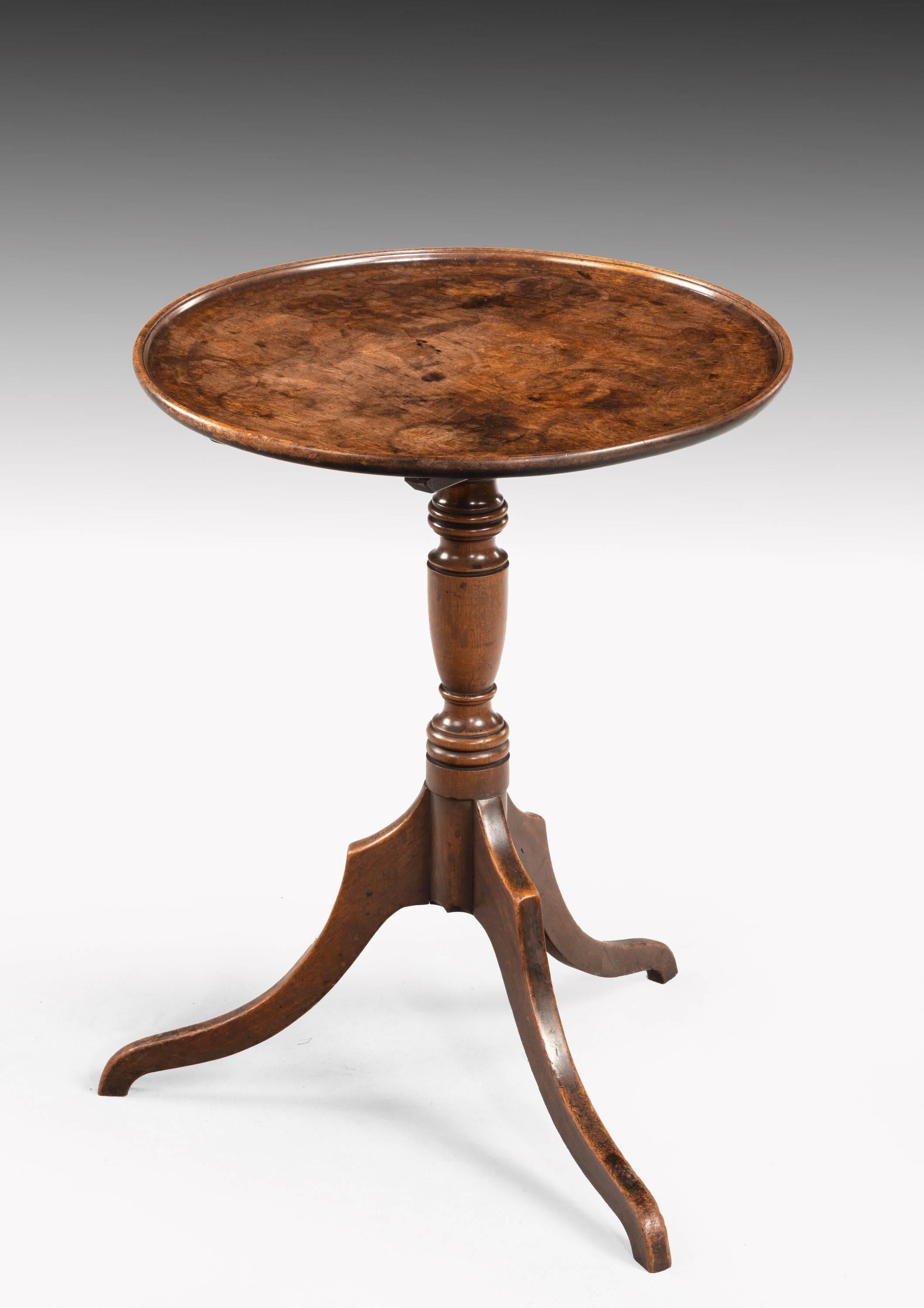 A George III mahogany tilt table of very small proportions. Of particularly fine color and patina.
    