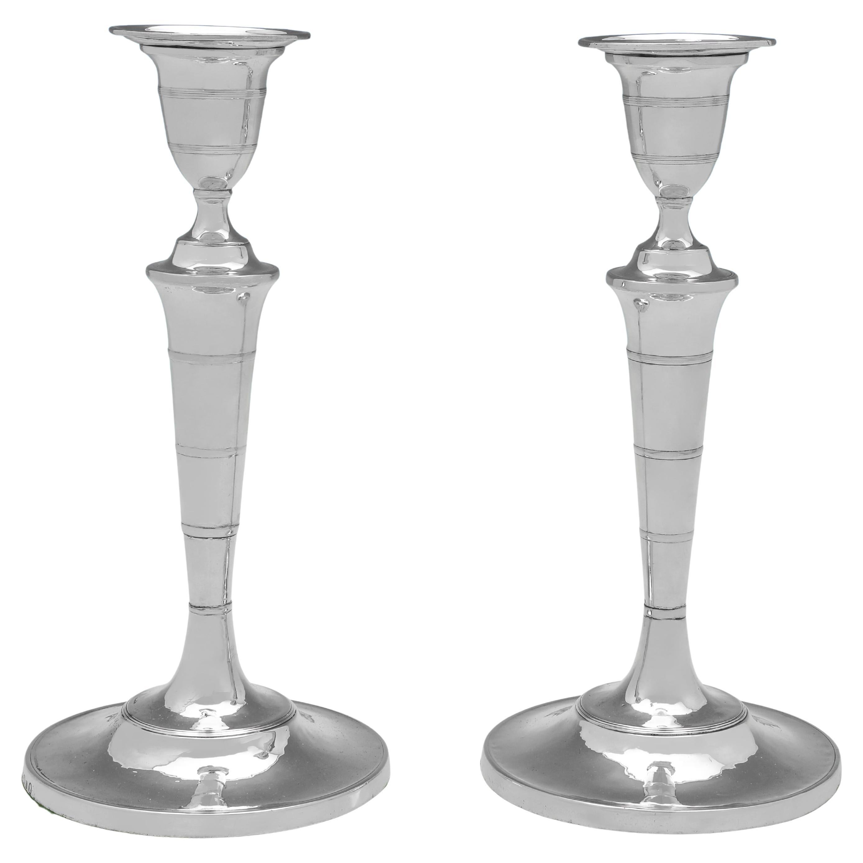 George III period pair of sterling silver candlesticks - hallmarked in 1792
