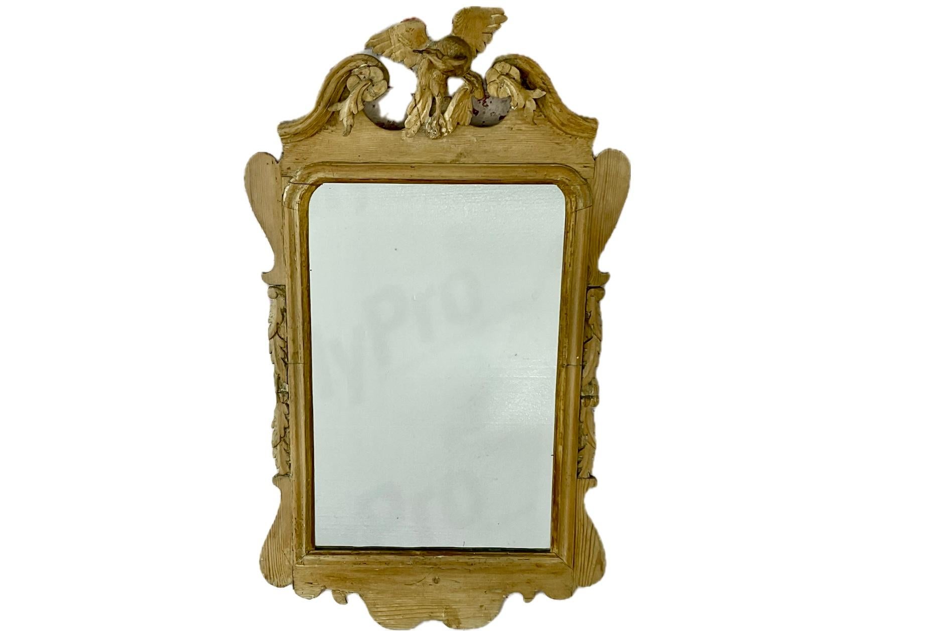Late 18th Century George III Stripped Pine Mirror. Unlike the more common gilded or painted examples of the period, this mirror remains in pine, offering collectors an opportunity to appreciate the craftsmanship and honest character of the carving.