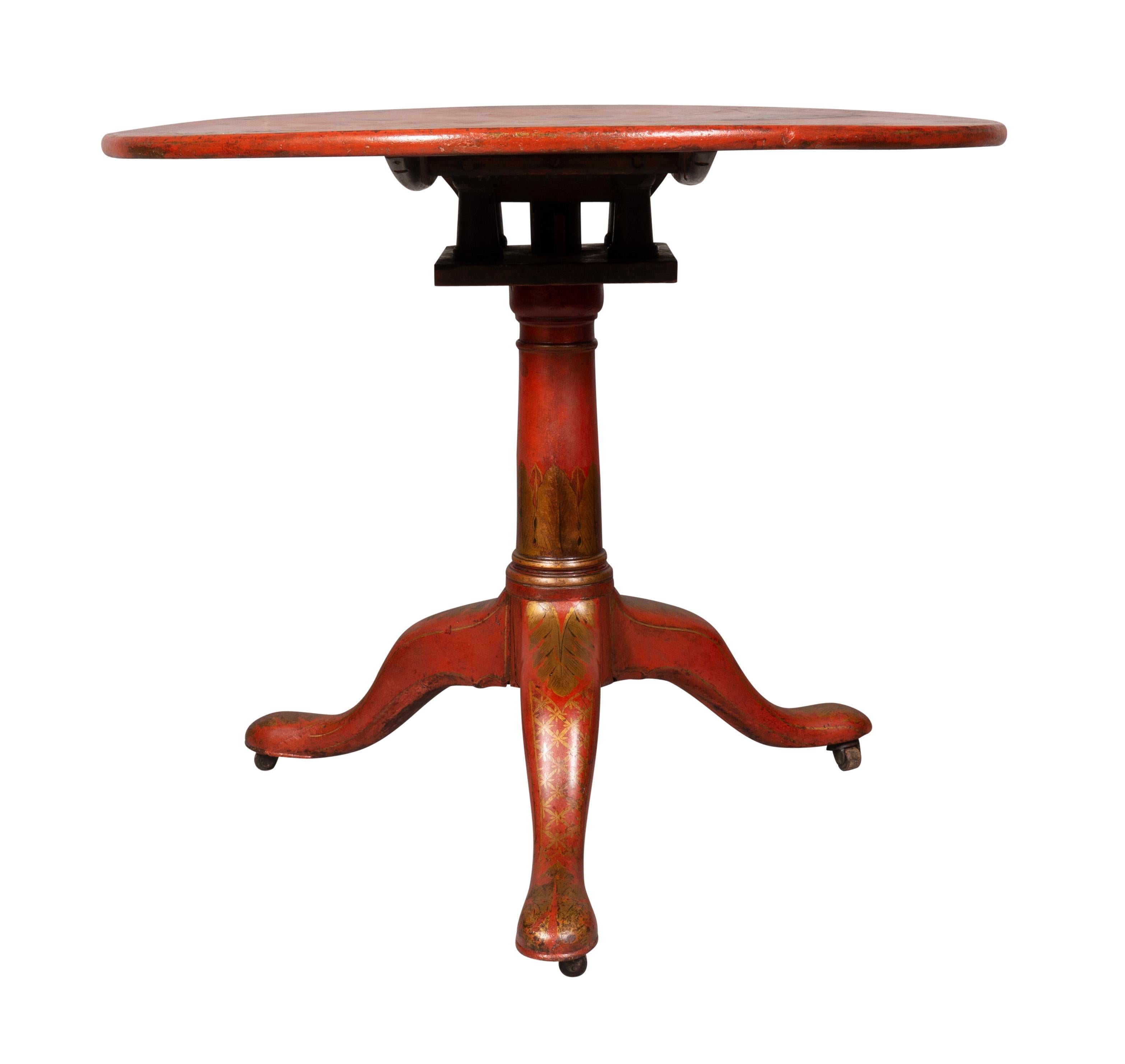 Circular hinged top with chinoiserie decoration on a turned support and three cabriole legs and pad feet.
