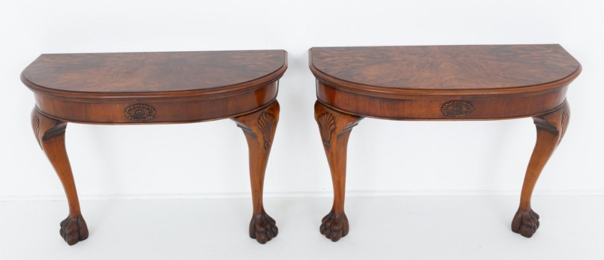 Pair of burr walnut console tables in the George III manner
These rather impressive console tables are raised upon cabriole legs with carved shells to the knees and carved hairy paw feet
Will ship to anywhere in the world - including US - so please