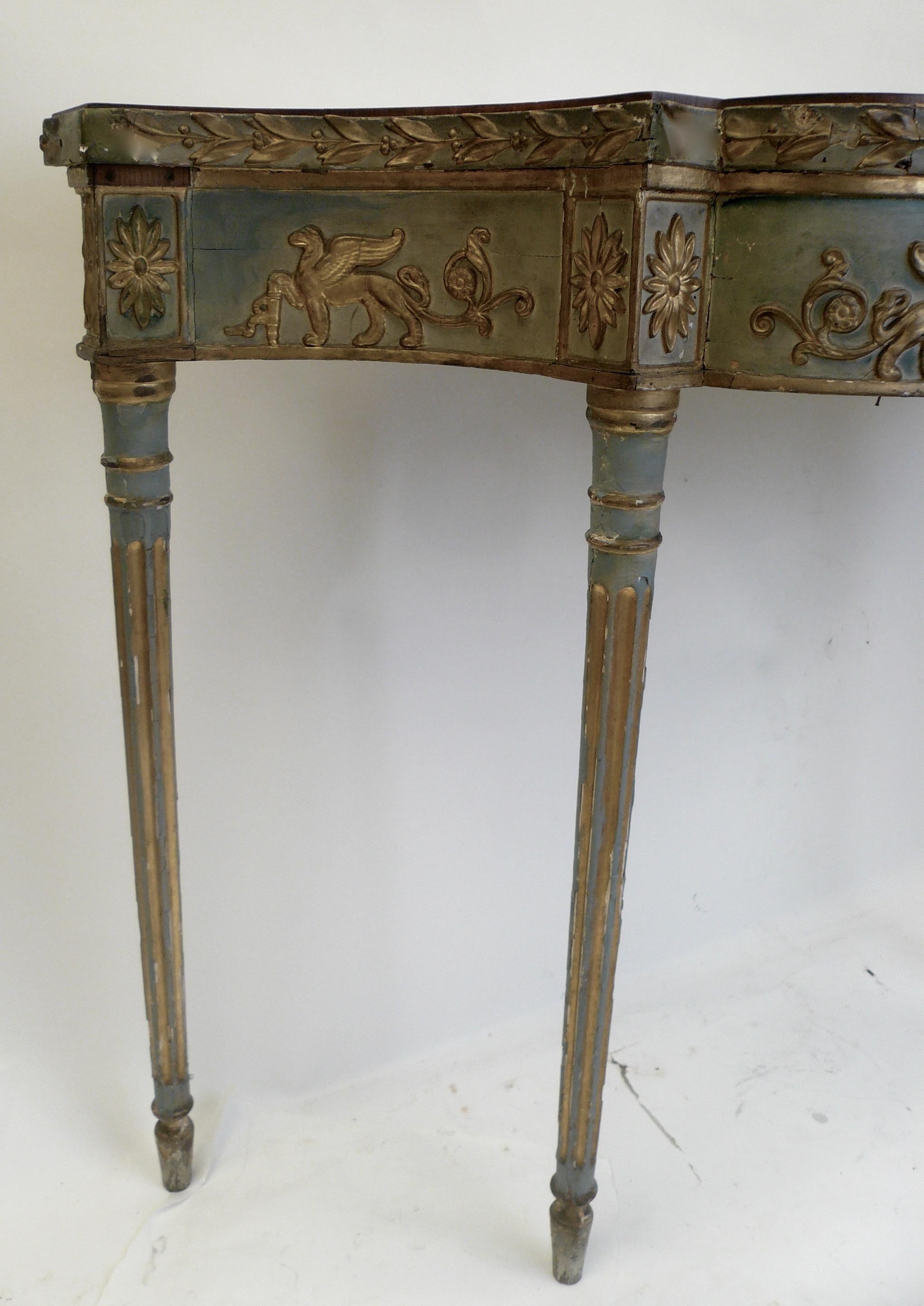 This painted Georgian console table features neoclassical motifs in the style of Robert Adam. Purchased from the Sewickley Pa. estate of Mrs. H.J. Heinz II, this table retains it's original painted finish.