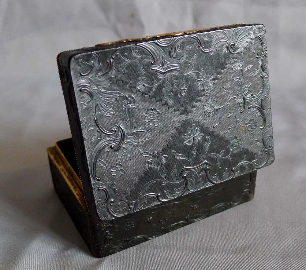An extremely rare antique English George III Rococo pressed tortoiseshell, ormolu and Battersea enamel snuff box. This beautiful oblong box is in pristine condition and has been well cared for throughout the past 250 years. The top and bottom is