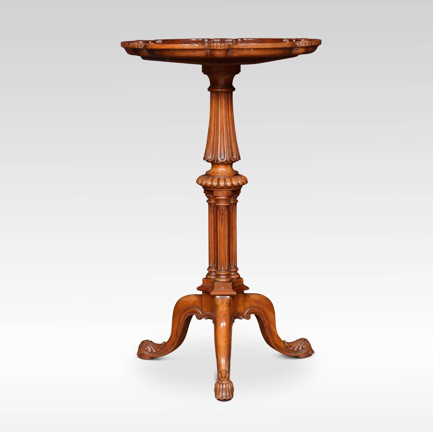 George III satinwood tri pod table in the manner of Gillows. The dished shaped round top with scalloped edge on a turned leaf carved triple cluster ringed stem and splayed tripod base with lappet carved pad feet.
Dimensions:
Height 29