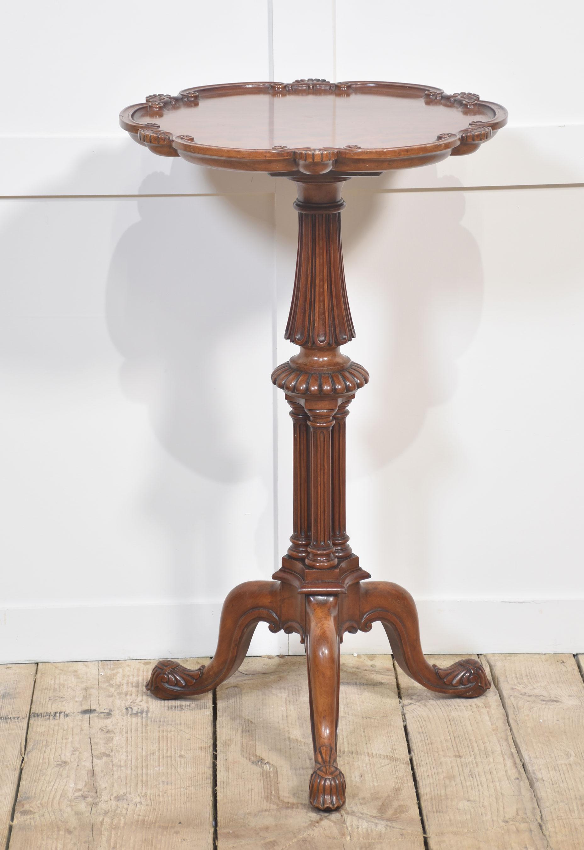 George III satinwood tri-pod table in the manner of Gillows. The shaped round top with scalloped edge on a turned leaf carved triple cluster ringed stem and splayed tripod base with lappet carved pad feet.
Dimensions
Height 29 Inches
Width 17