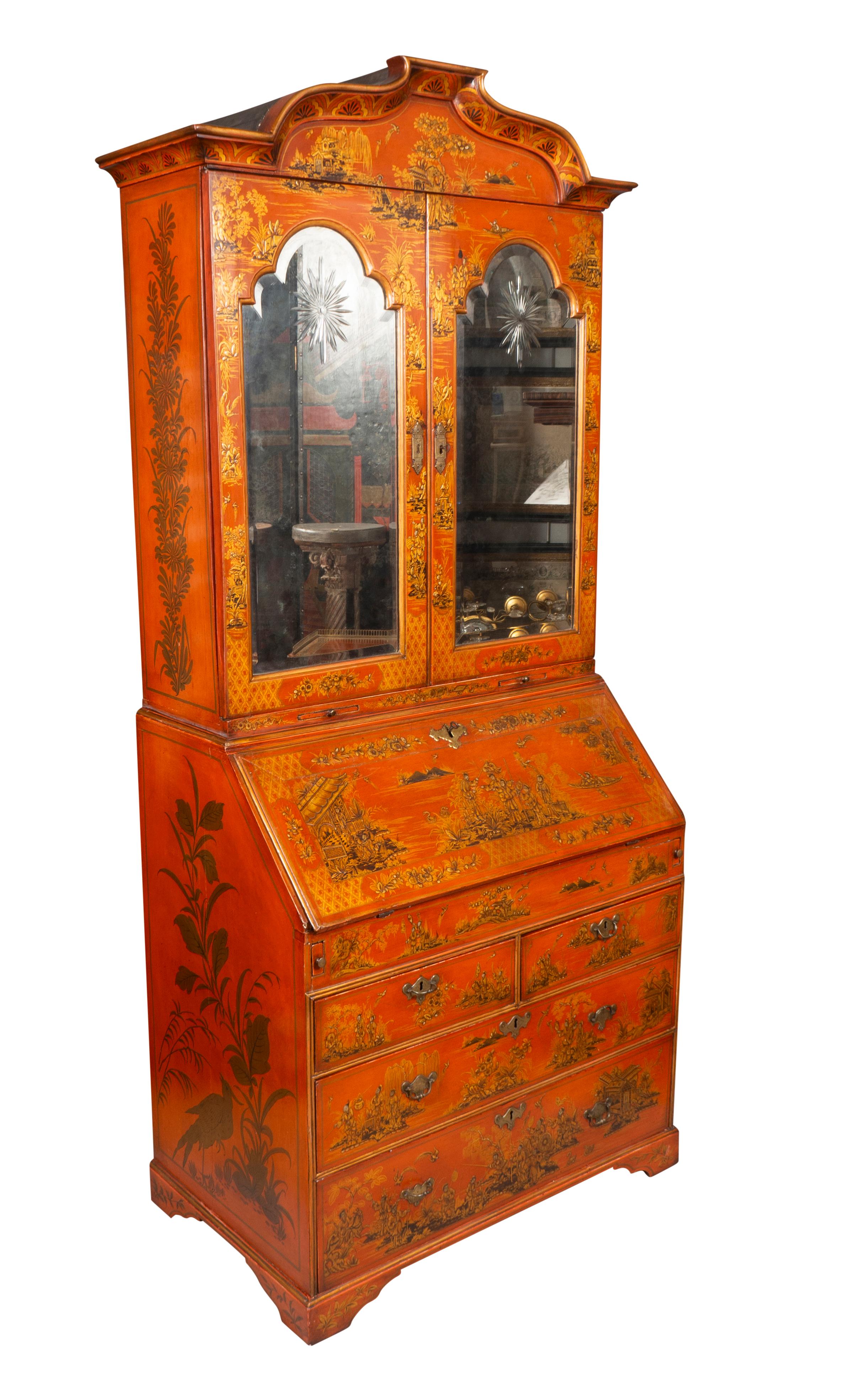 The case 18th century with later scarlet Japanned decoration. With shaped arched pediment over a pair of arched doors with beveled glass. Opening to an elaborate interior with various drawers and doors, cubbys etc. Two candle slides. The desk