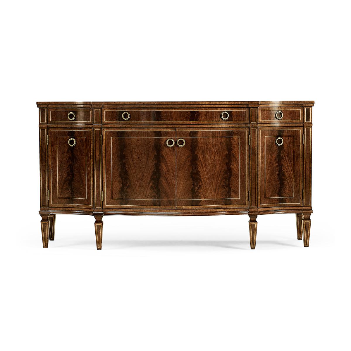 Substantial George III style bow fronted serpentine sideboard with four doors, flame mahogany veneers, and three drawers to the upper register. Contrasting stringing throughout and raised on square cross-section feet. 

Dimensions: 72.75