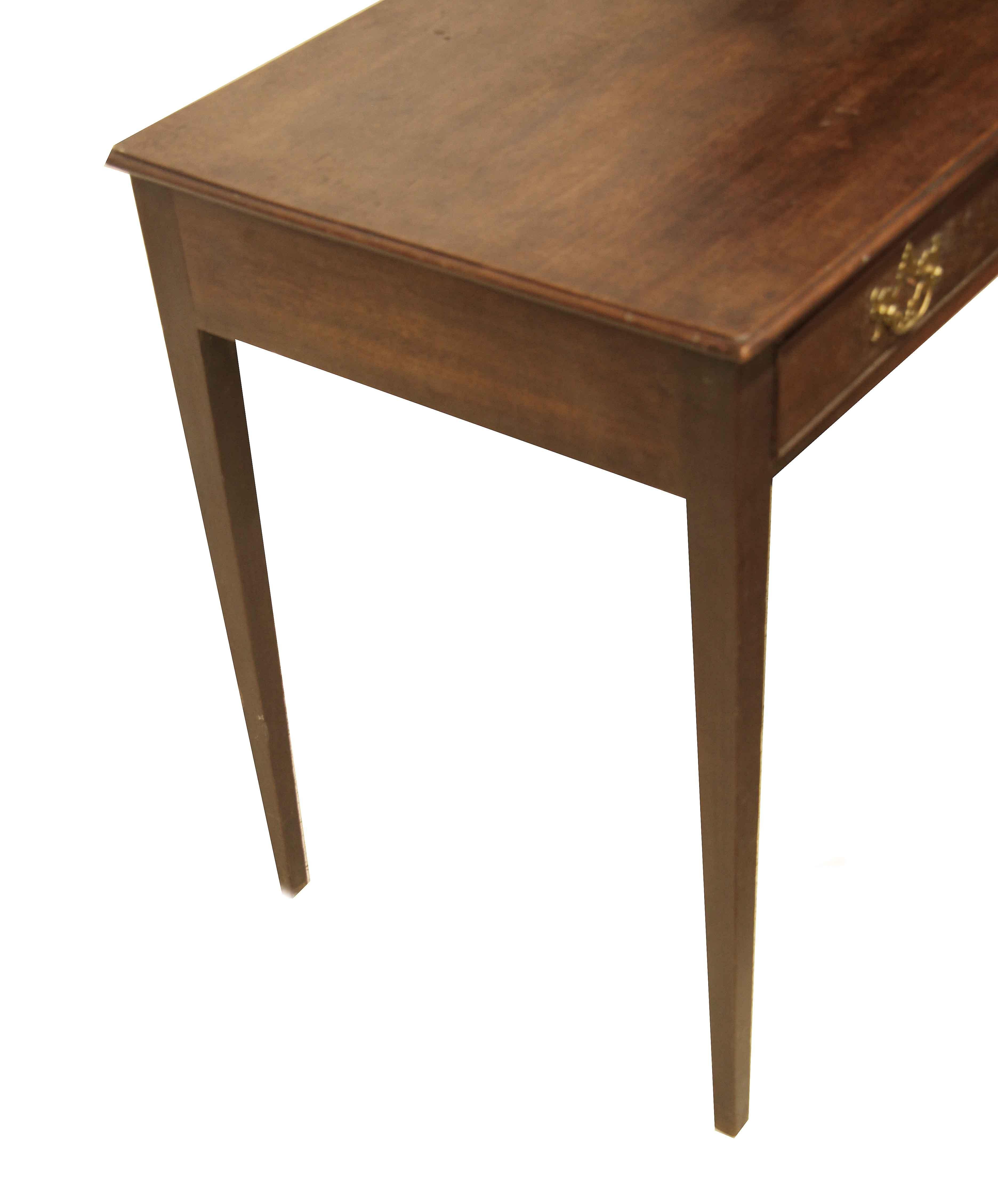 George III side table,  this mahogany table has a warm original patina, the top with molded edge( not applied), the single drawer has open work brass pulls and matching escutcheon and oak secondary wood.  The legs are nicely tapered.