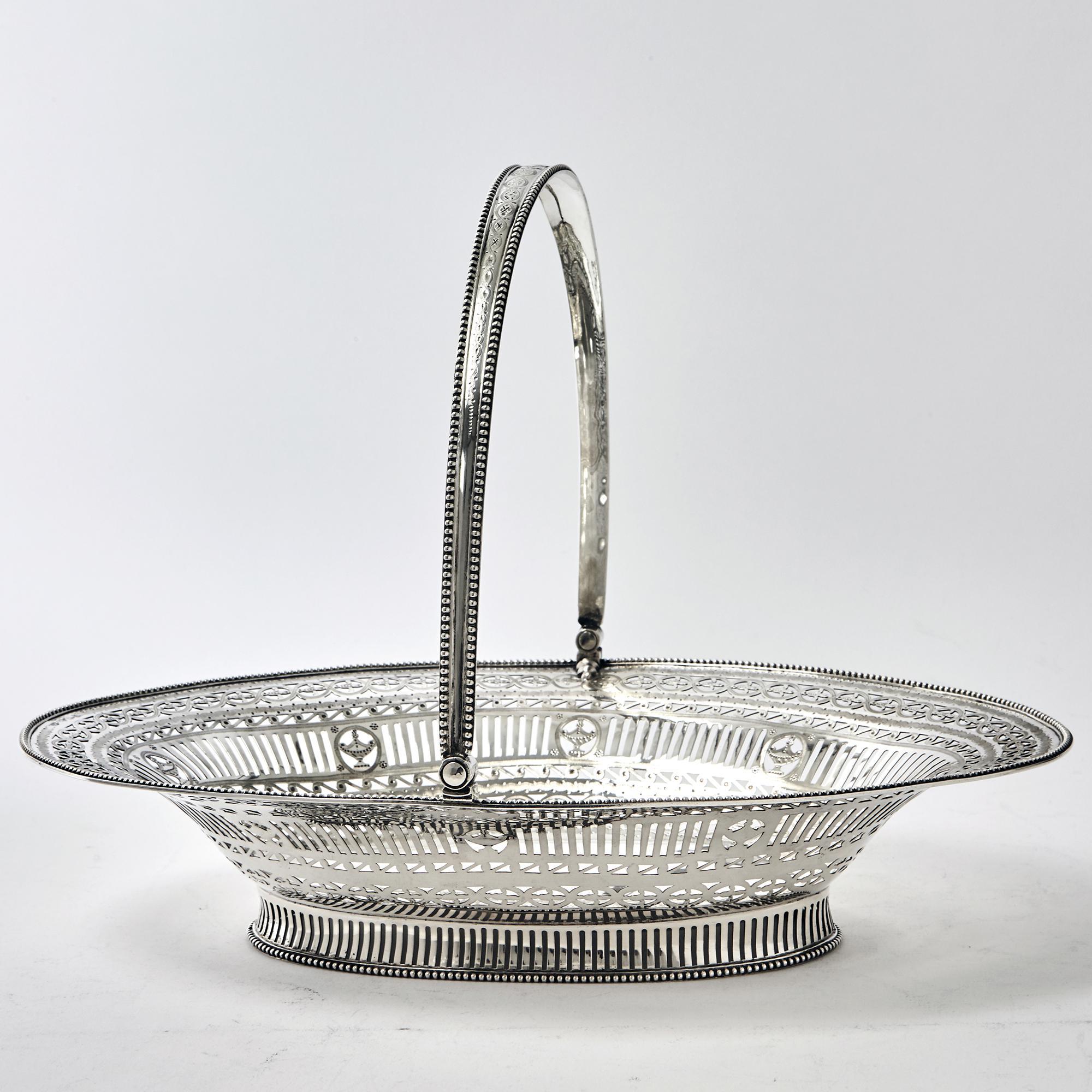 Fine example of Adam-style, neoclassical design incorporated into a finely made silver basket by premier female silversmith, Hester Bateman. The basket is hand-pierced and engraved and the border and handle have applied 'bead' pattern mounts. This