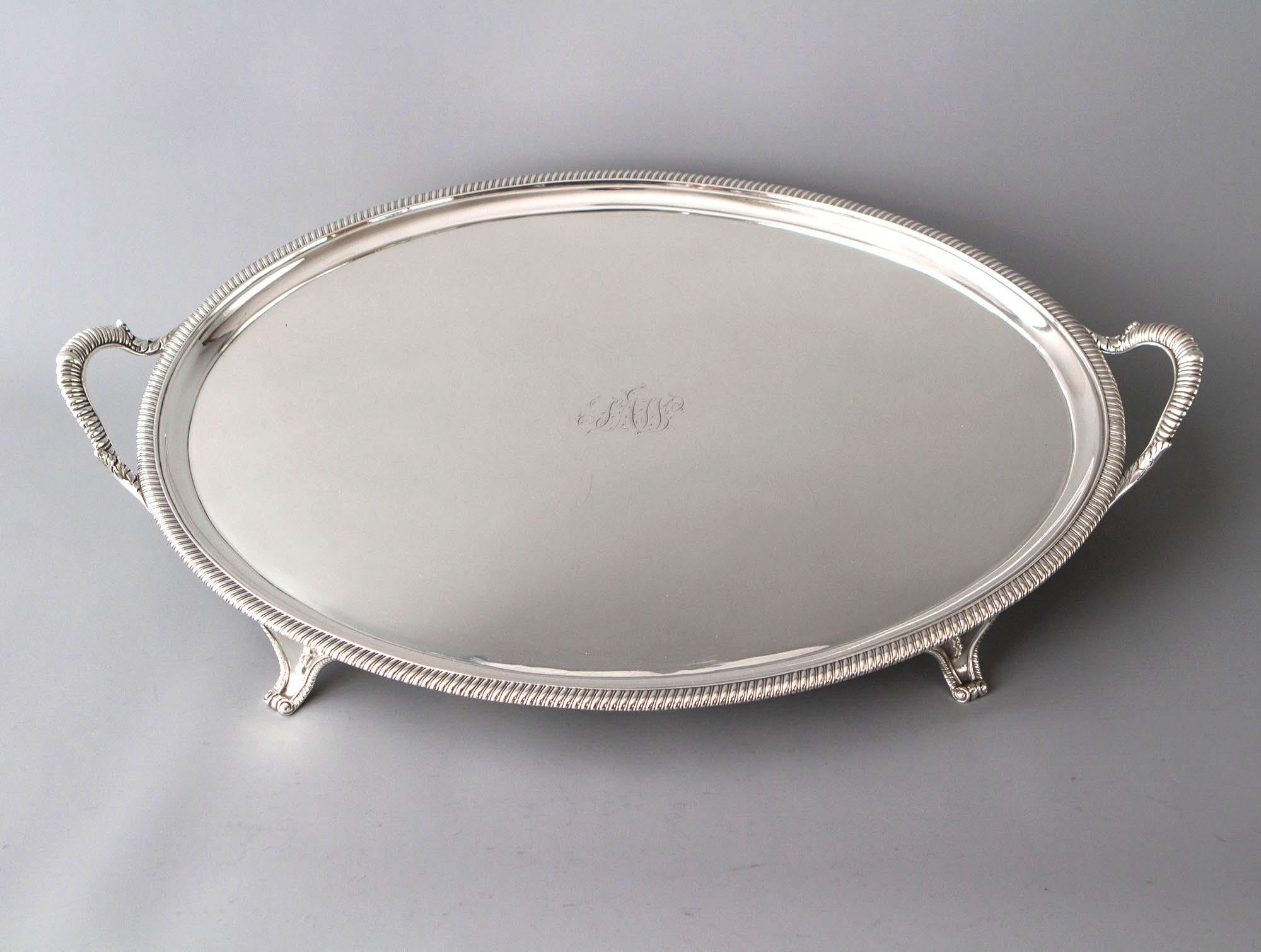 A very good quality George III oval silver tray with twin handles and gadrooned edges. The whole standing on four scrolled panel feet.
 
Clearly marked to the underside for London 1811 by Peter and William Bateman.
 
This is an exceptionally