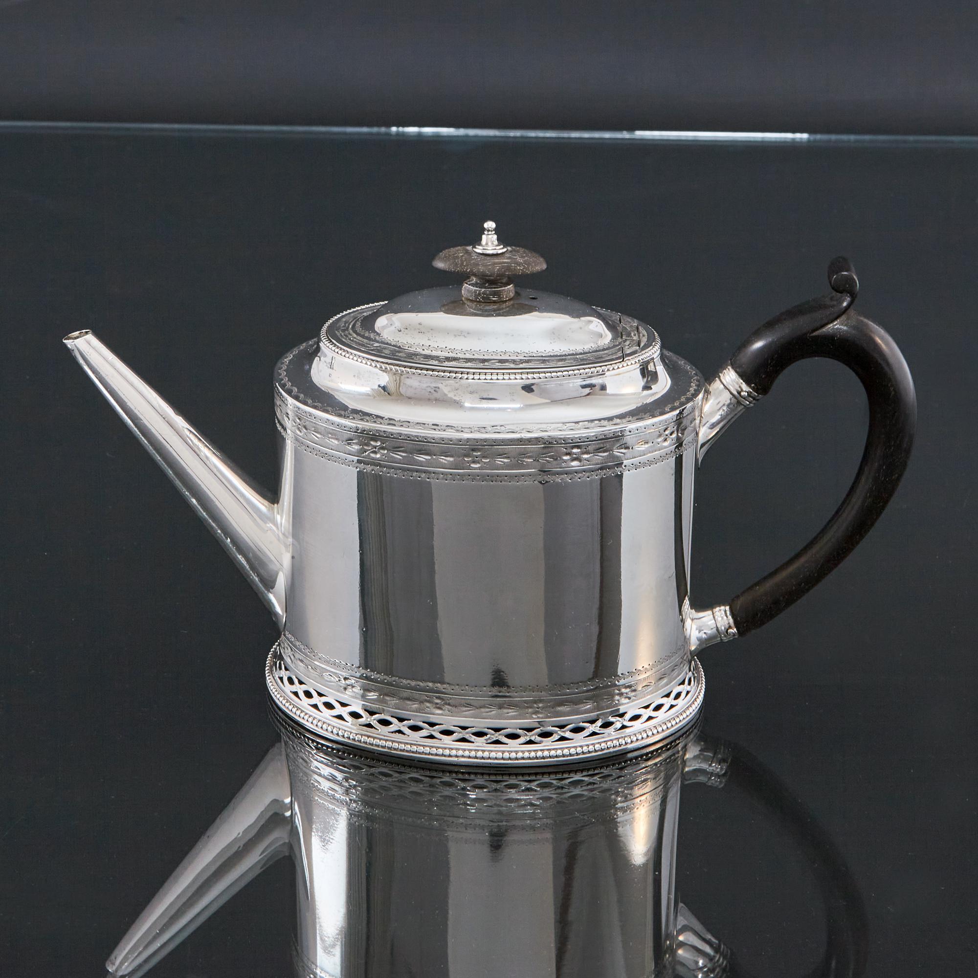 Beautiful and elegant neoclassical style antique silver teapot by the premier female silversmith, Hester Bateman. This 18th century silver teapot is engraved with some of neoclassical motifs of the period - floral swags, ribbons and bellflower