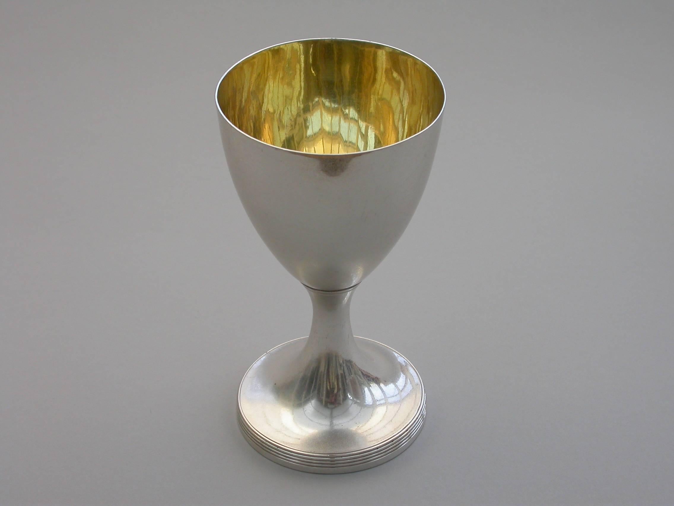 A good quality George III small silver Goblet of plain form with reeded border to the pedestal base. Silver gilt interior. The base with contemporary dated presentation inscription. 

By Henry Chawner, London, 1792.

The perfect size for a glass