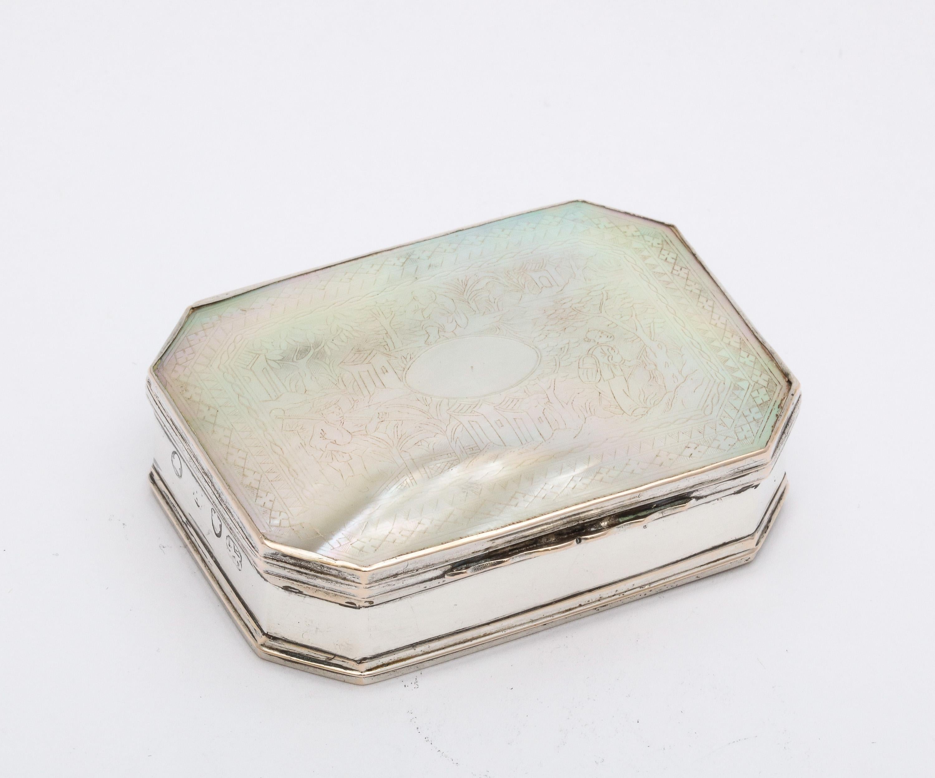 Georgian (George III) Period, sterling silver-mounted etched mother-of-pearl octagonal snuff box with hinged lid, London, year-hallmarked for 1803. The iridescent mother-of-pearl lid is lightly etched with a Chinese country scene (see video). The