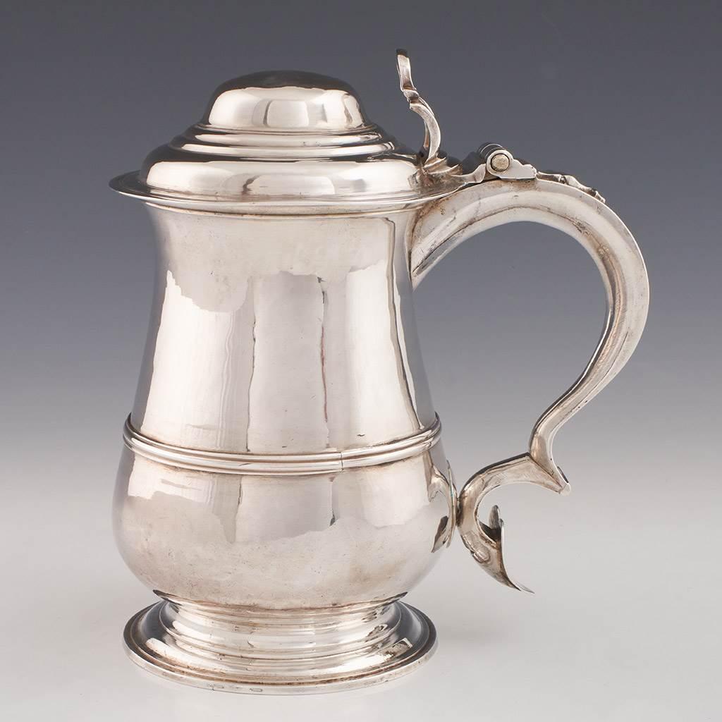 Heading : Sterling silver quart tankard
Date : Hallmarked in London in 1763 for William and James Priest
Period : George III
Origin : London. England
Decoration : Baluster form with reeded band and terraced domed cover. Openwork thumbpiece and heart