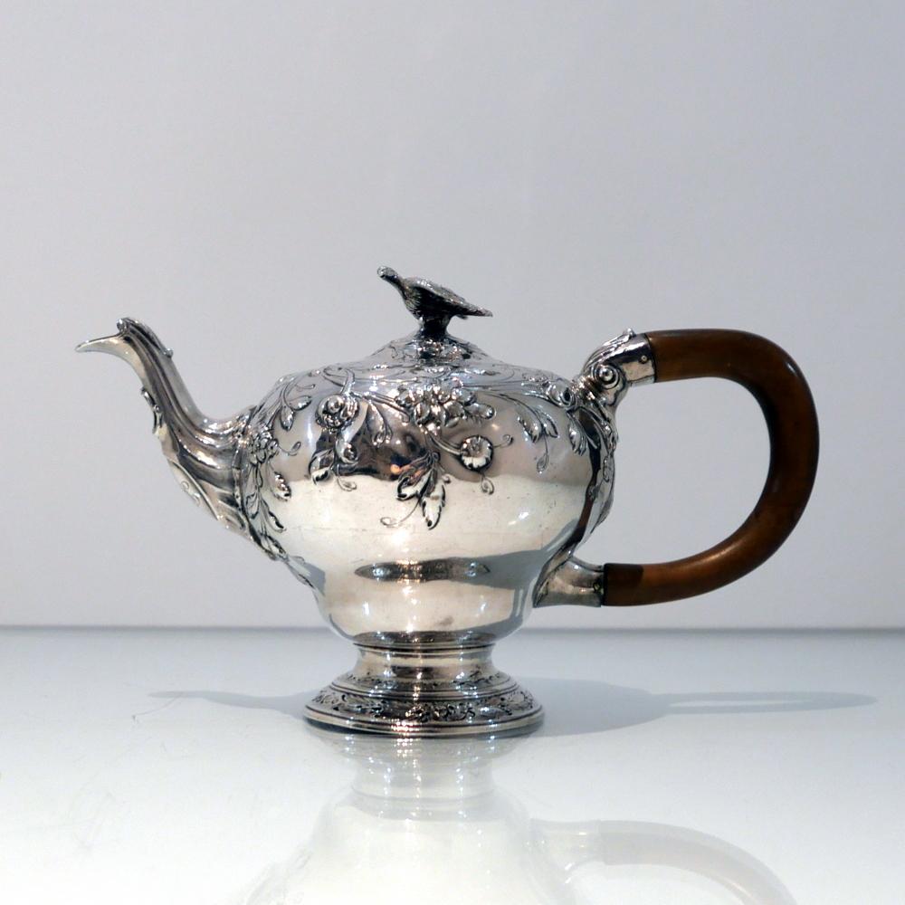 A rare and extremely fine early George III Rococo bachelor teapot decorated with fabulous contemporary floral embossing. The slightly domed lid has an elegant flush hinge and is crowned with a stylish finial.

 Weight: 18.25 troy ounces/567