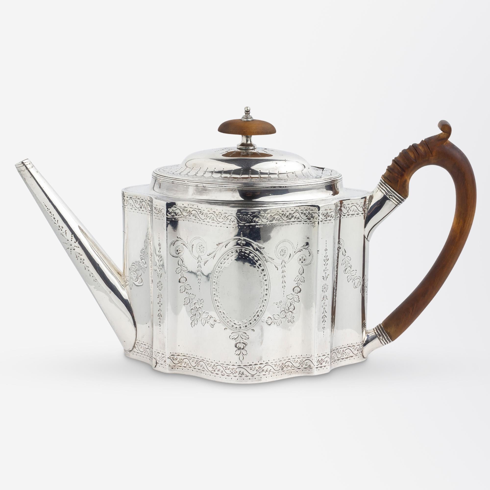 A George III period, sterling silver teapot with a timber handle and finial by Peter and Jonathan Bateman of the famed Bateman silversmithing family. The teapot is hallmarked for London, 1790 and is a rare piece because the partnership of Peter &