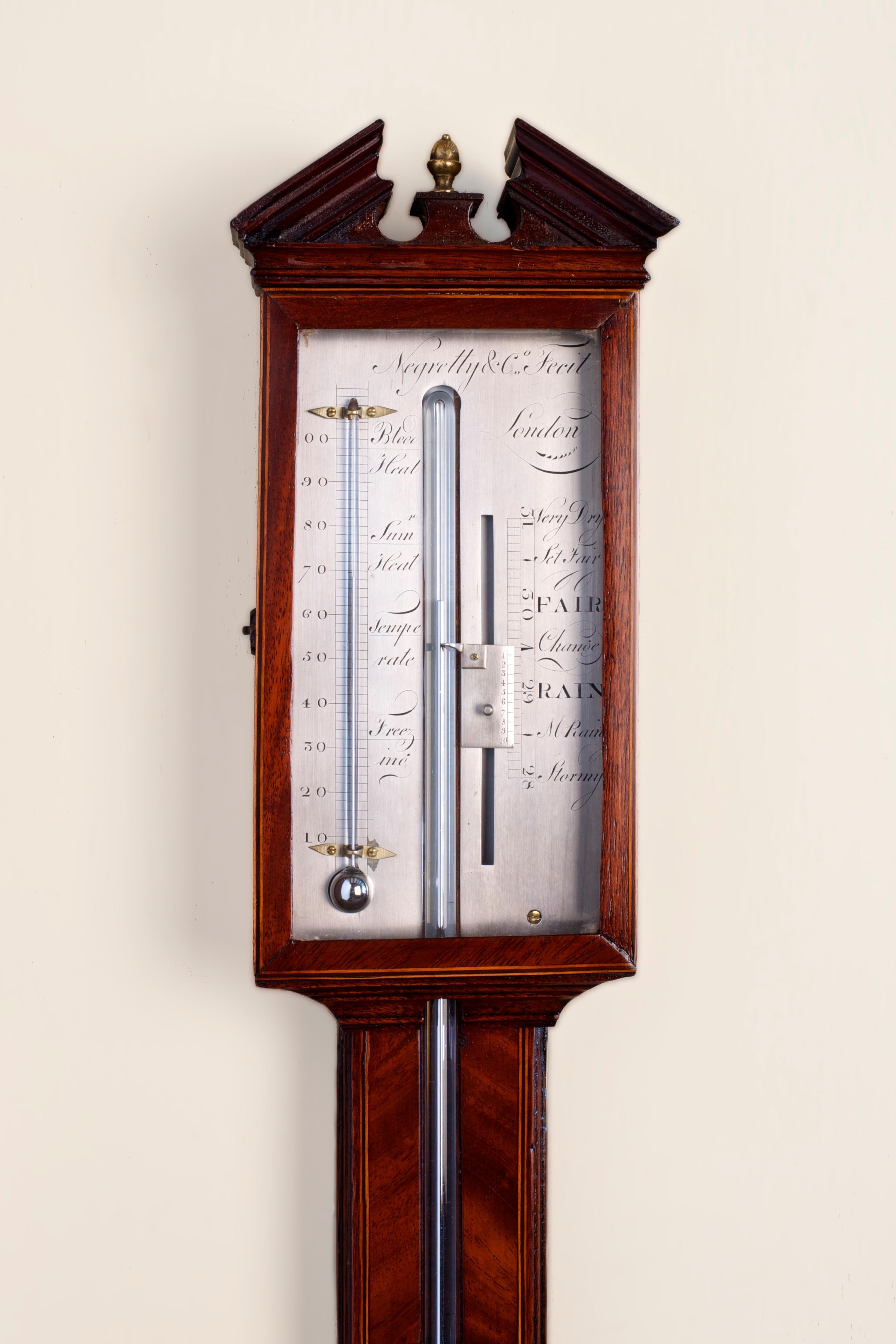 Stunning George III stick barometer


Highly grained and beautifully figured mahogany case with satinwood stringing, broken arch pediment with original brass central finial, turned and ringed cistern cover with ivory inlay. 

Glazed door