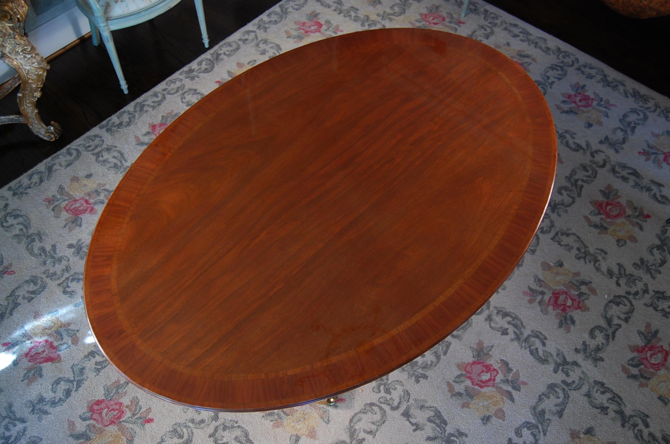 George III Style Banded Mahogany Oval Dining Room Table on Single Pedestal Base In Excellent Condition For Sale In Pittsburgh, PA