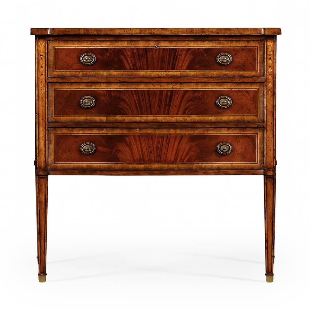 George III style serpentine fronted chest of three mahogany and crossbanded drawers with patinated brass oval handles raised on tapering paneled legs with brass caps. Ideal as a bedside cabinet. 

Dimensions: 40.25