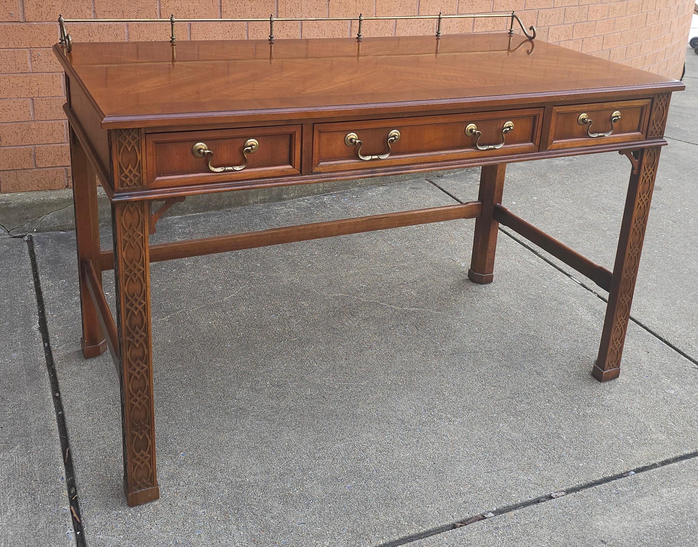 A George III Style Blind Fretwork Mahogany Table wrting Desk. Measures 48