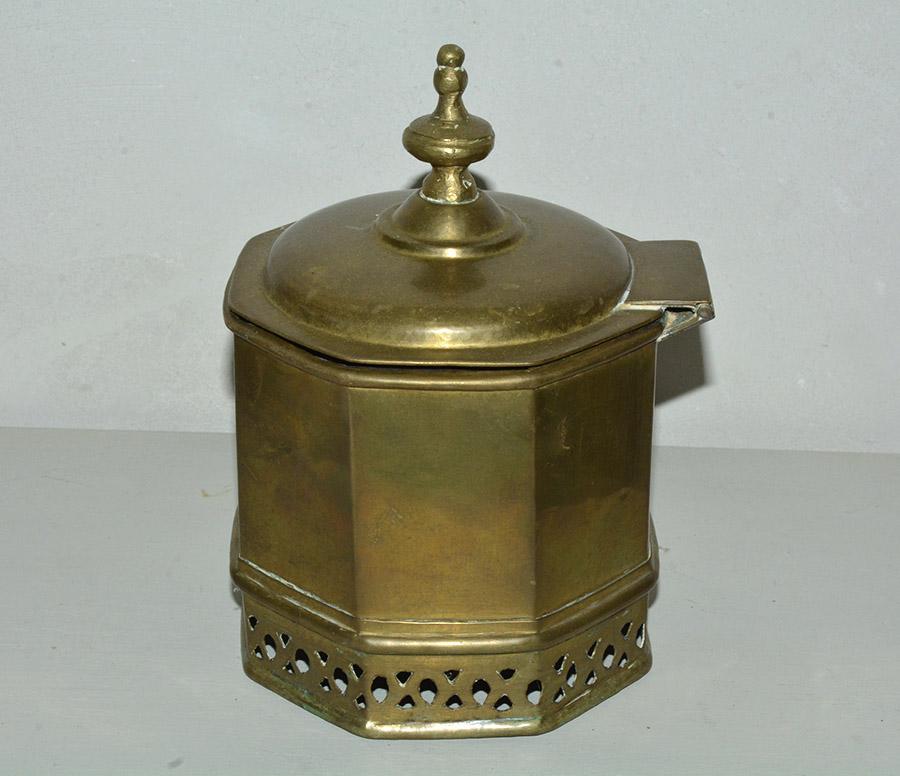 George III style with Moorish mid-eastern or Indian influence, large decorative octagonal bronze tea caddie box with a hinged lid. The box has perforated holes design at the base, octagonal body topped by lid with a finial. Wonderful antique