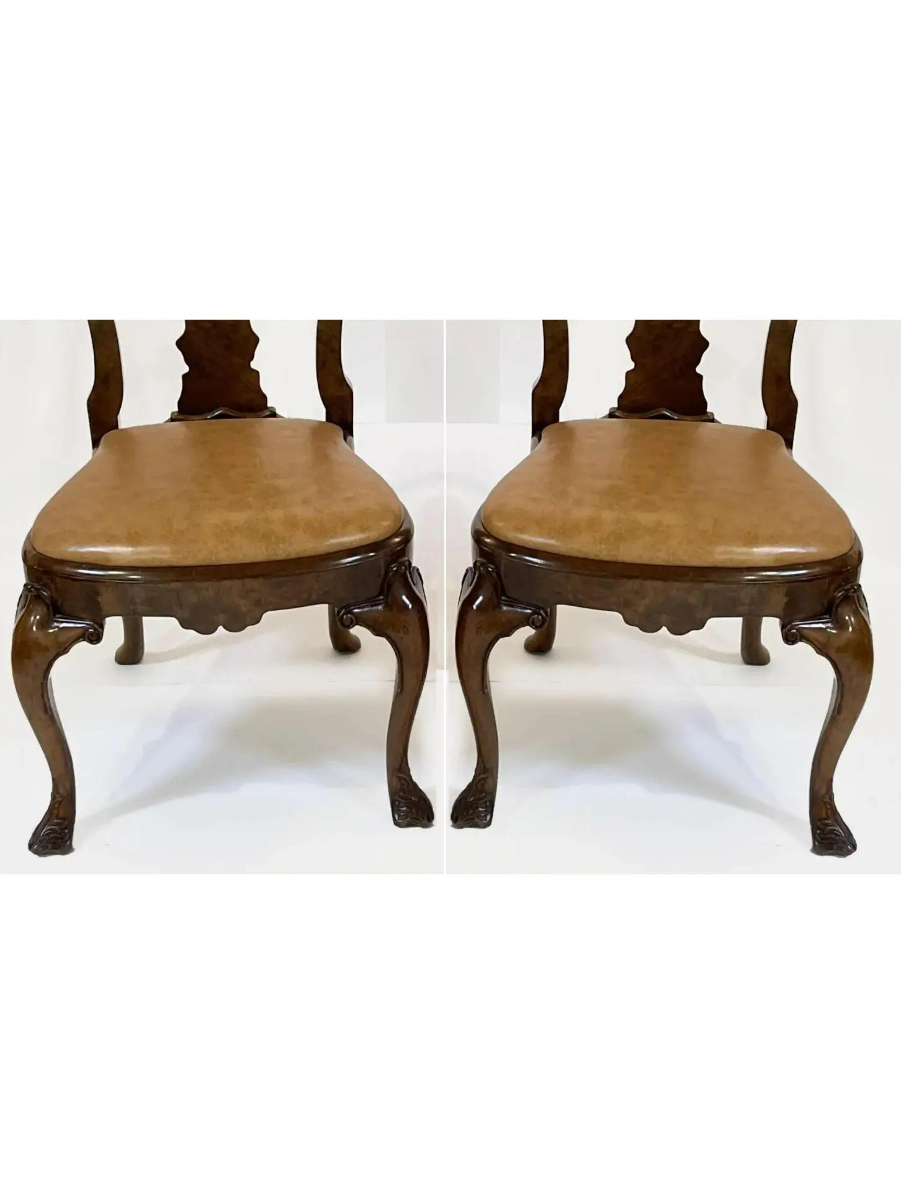 George III Style Burton ching burl walnut dining chairs. Each features a genuine leather seat and exquisitely carved details.

Additional information: 
Materials: Leather, Walnut
Color: Brown
Period: 1990s
Styles: Georgian
Number of Seats: