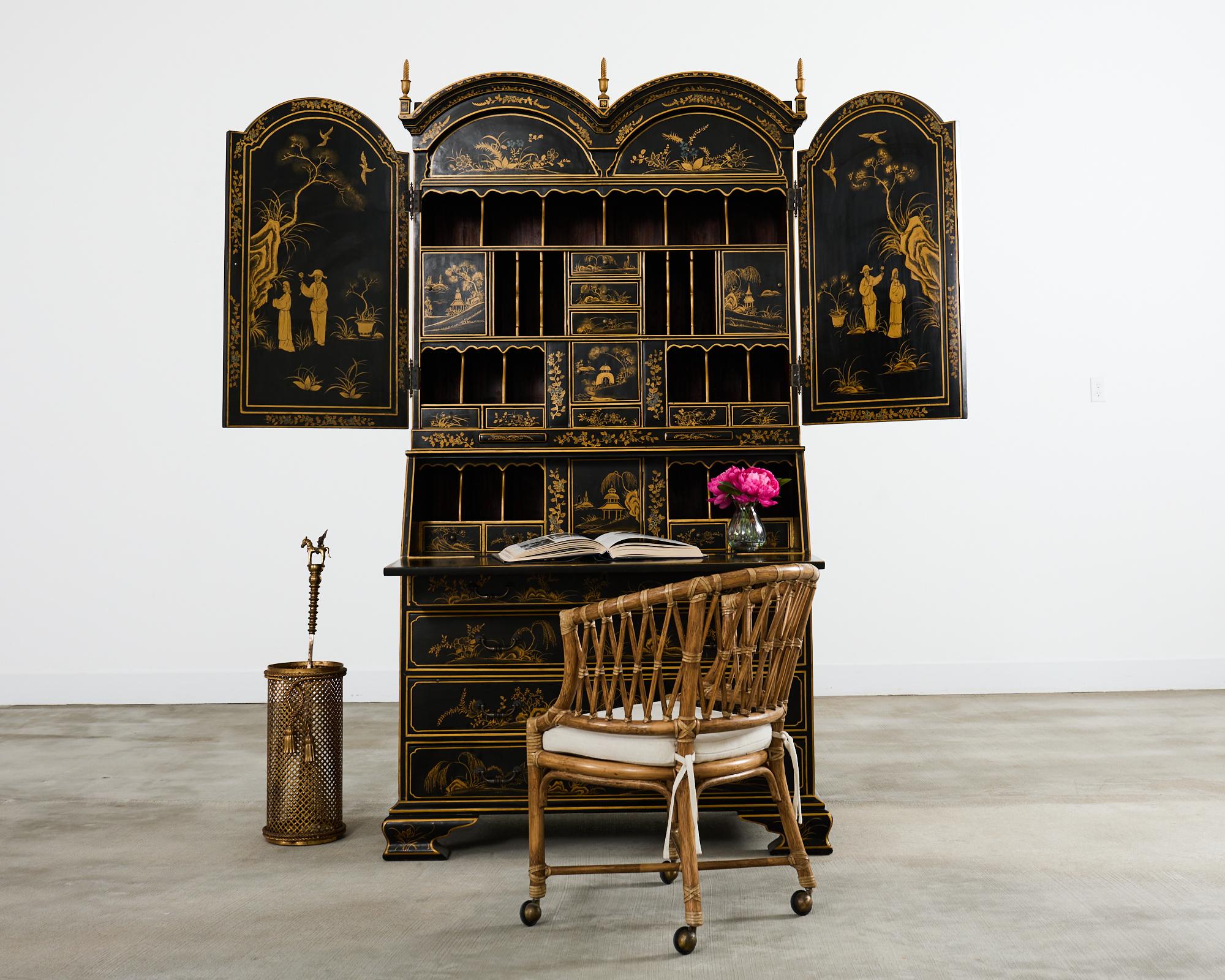 Grand English George III style secretaire bookcase embellished with parcel gilt chinoiserie reserves. The 2 part case is beautifully decorated with idyllic Asian scenes having figures amid flora and fauna. The top case has a double segmental